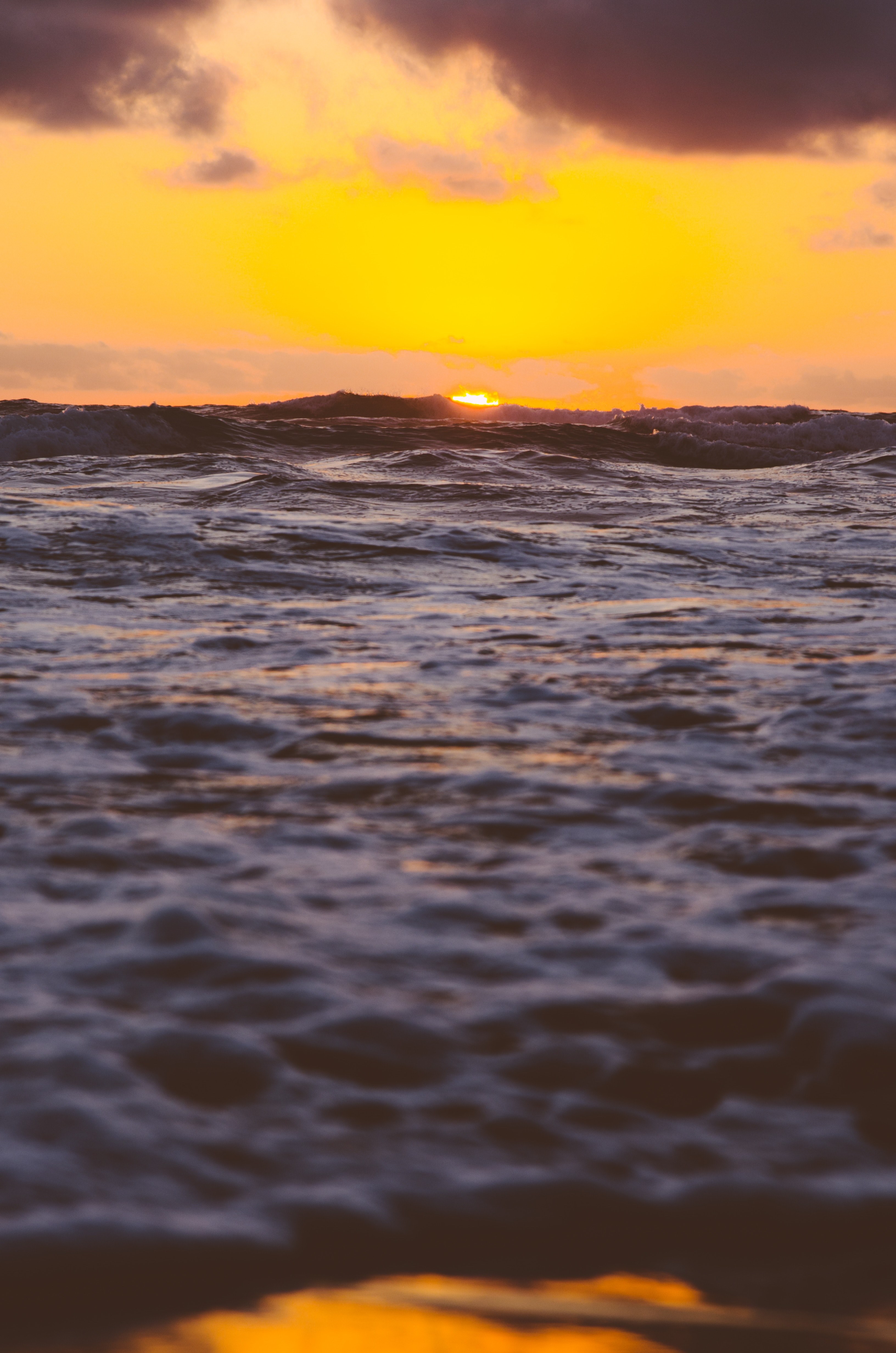 an orange sky at sunset over the waves of the ocean at venus bay, wave after wave 4k, Phone HD Wallpaper