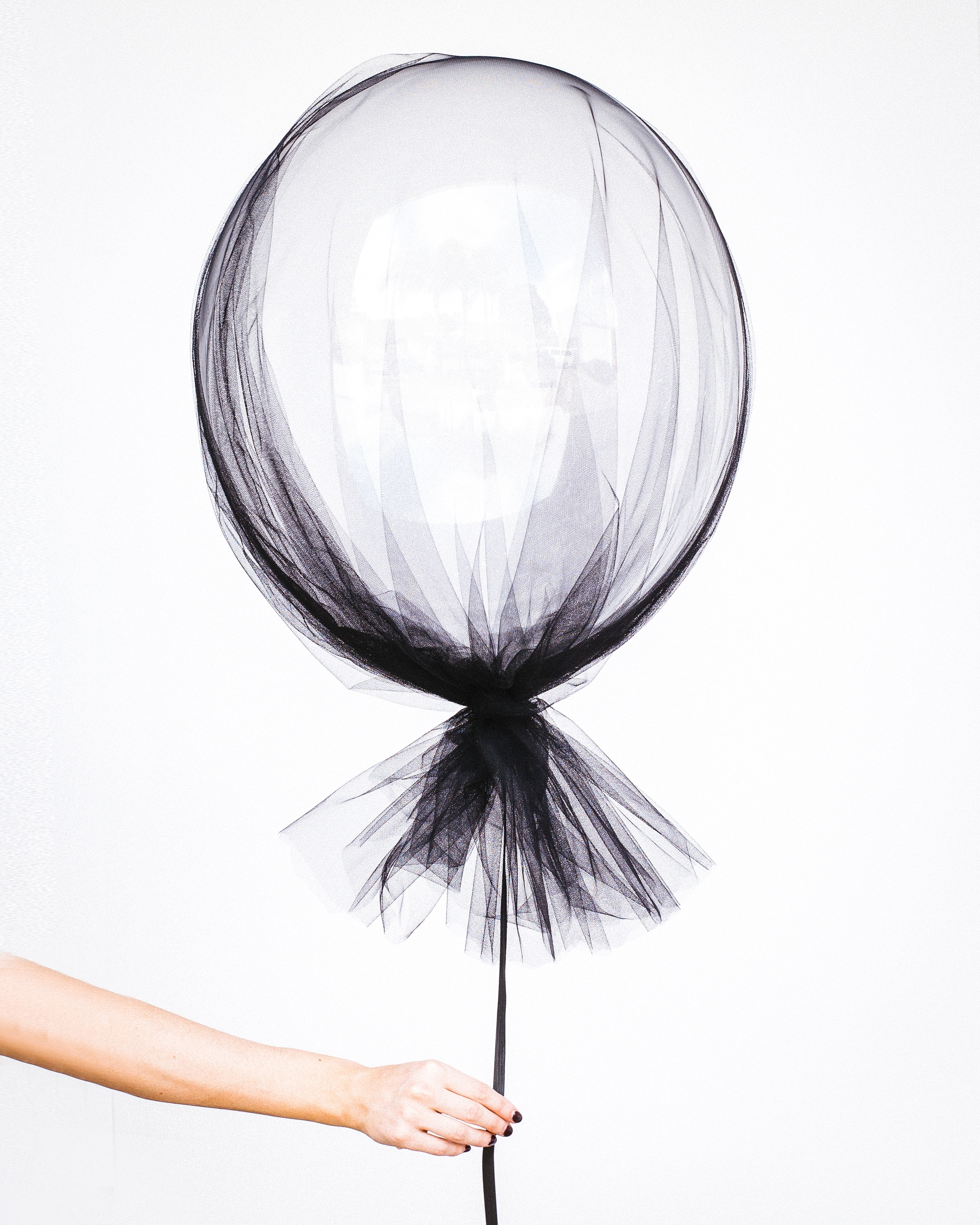 a woman holding a white balloon on her hand with a black string in sydney, a womans white balloon 4k, Phone HD Wallpaper