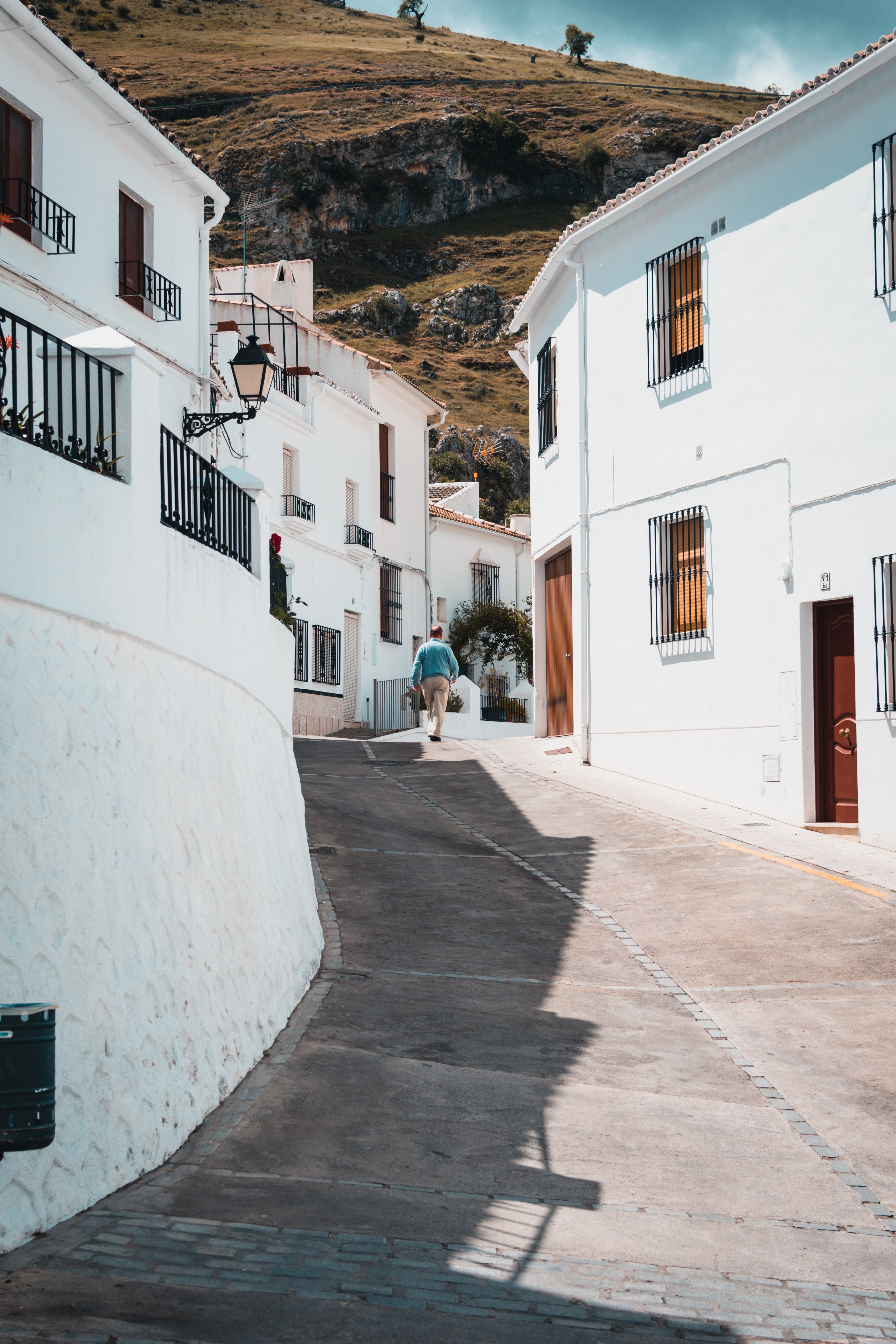 a hilled street with houses all over the cliff in zuheros, the white village 4k, Phone HD Wallpaper