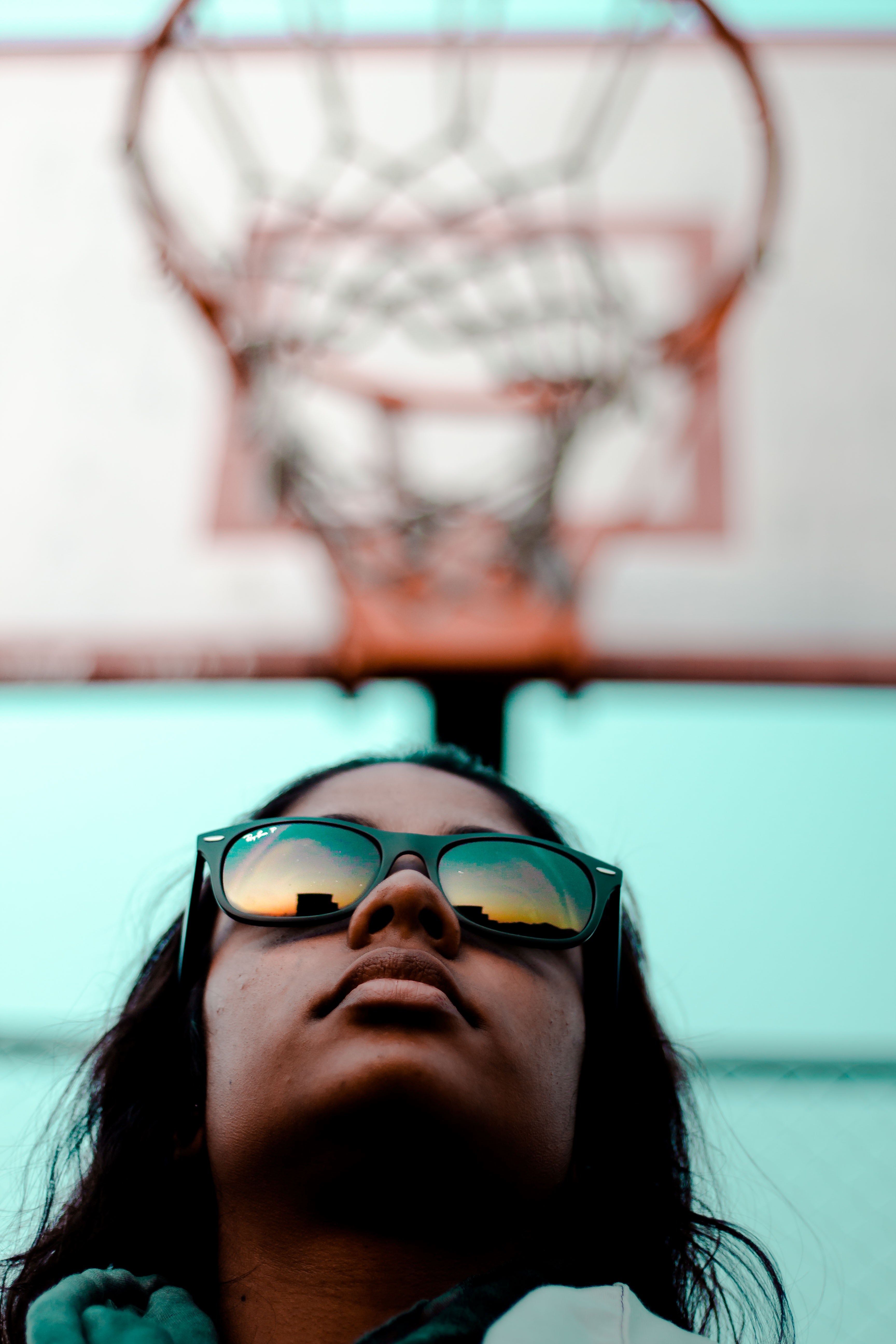 a woman in reflective sunglasses looks upward beneath a basketball net in johannesburg, woman below basketball net 4k, Phone HD Wallpaper