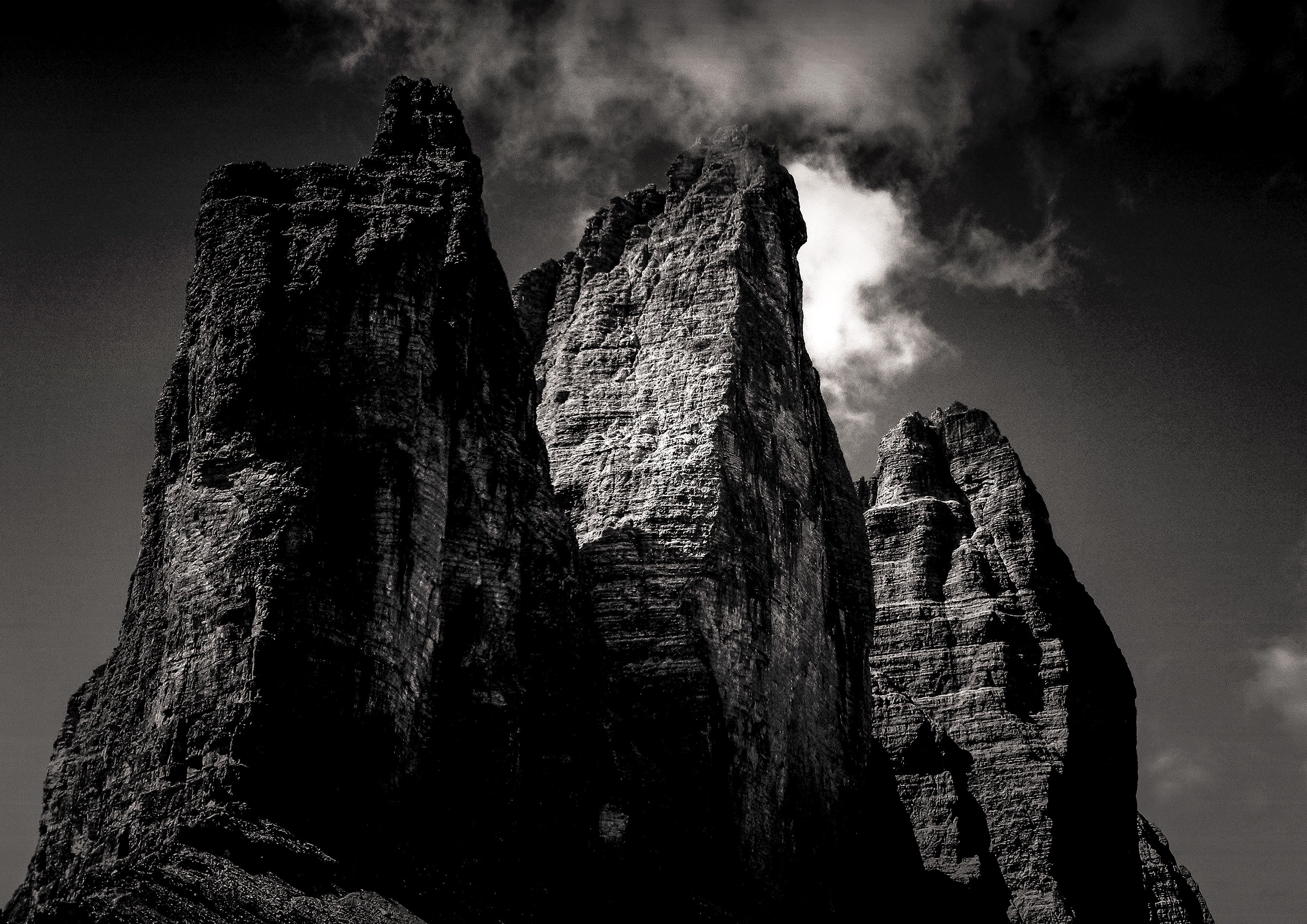 eerie rock formations against a stormy dark sky, rocky peak and cloud 4k, HD Wallpaper