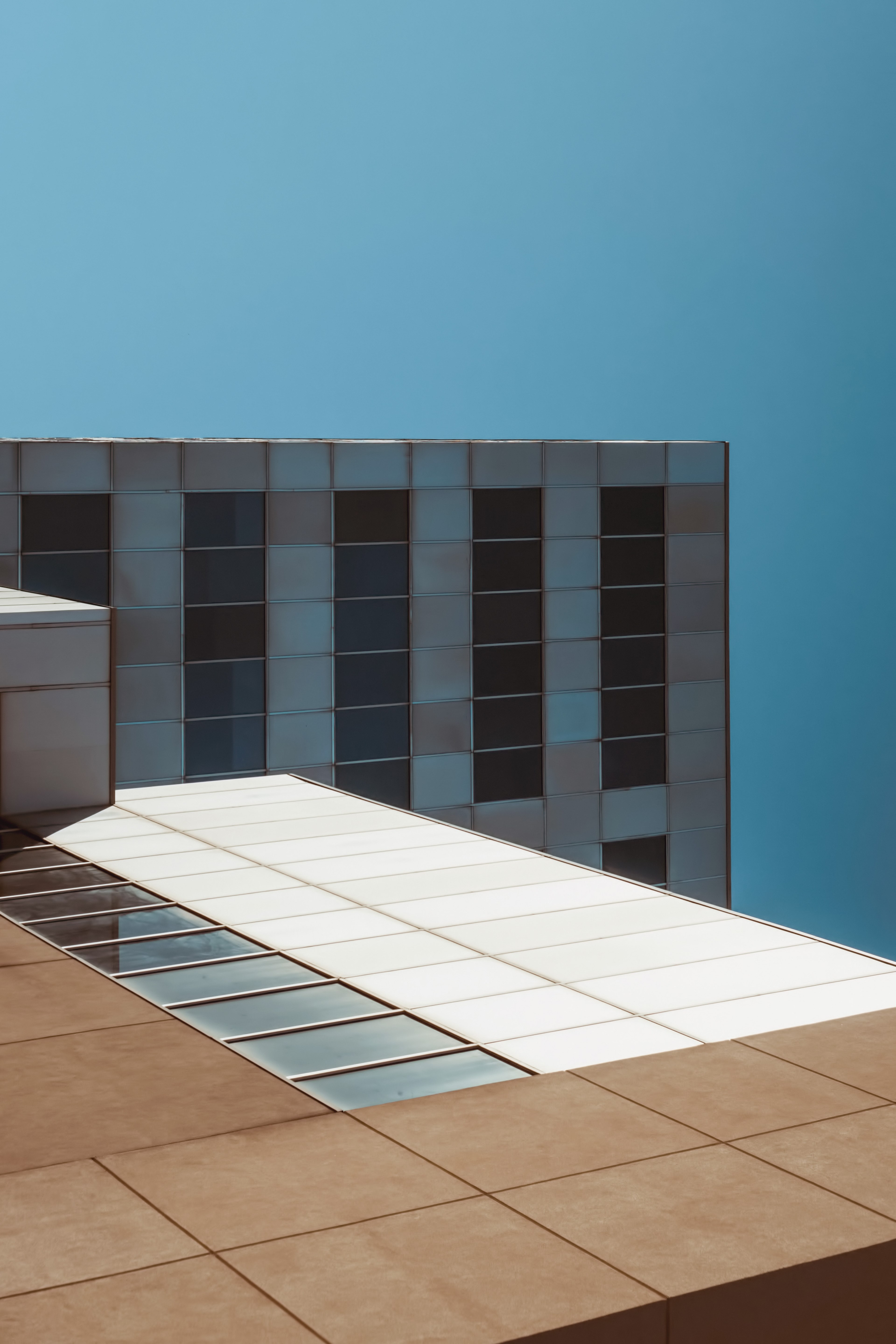 an angular shot of the tiled facade of a building in saint catharines, corbloc tetris 4k, Phone HD Wallpaper