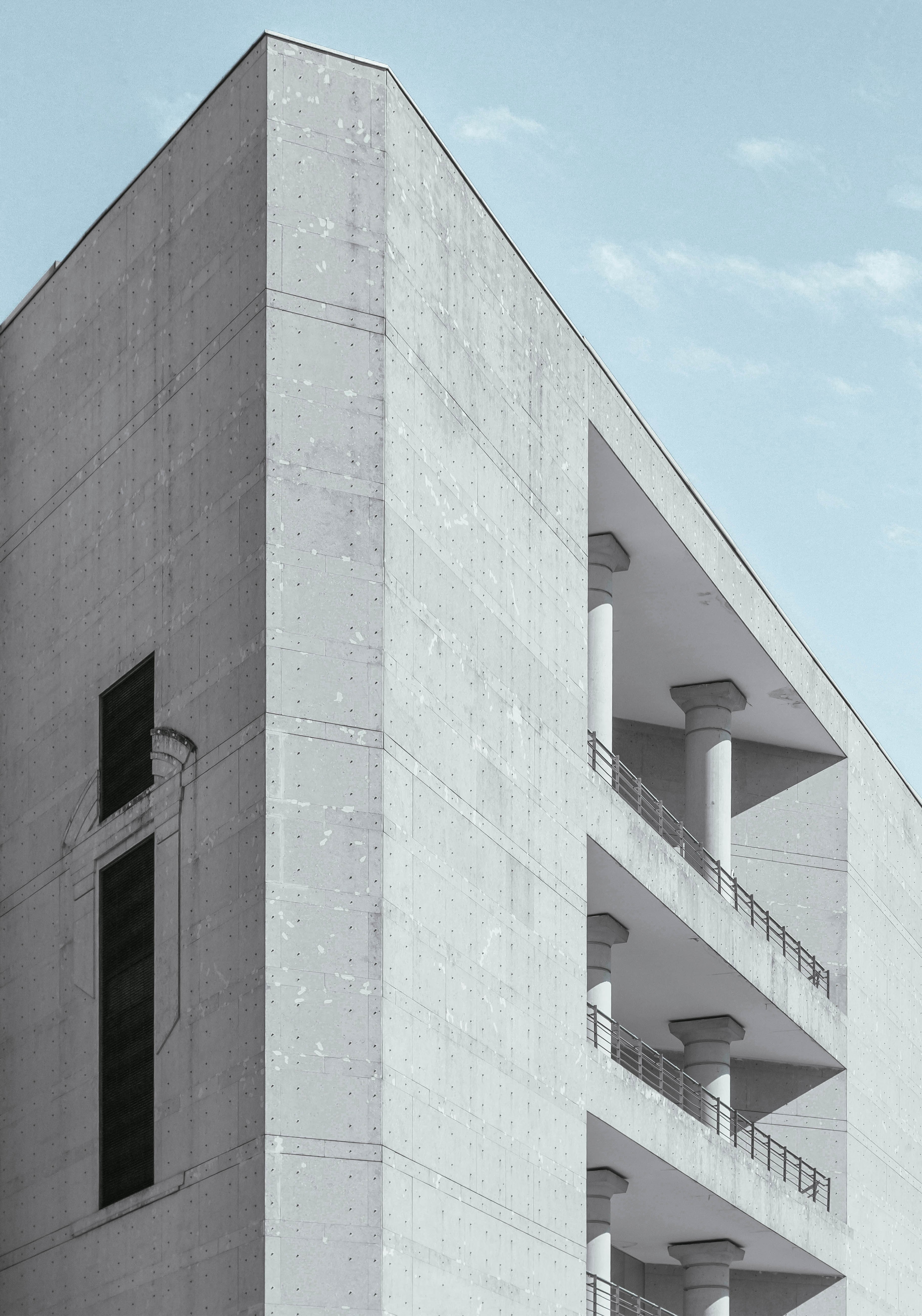 a gray concrete building with columns on its balconies, rough concrete building 4k, Phone HD Wallpaper
