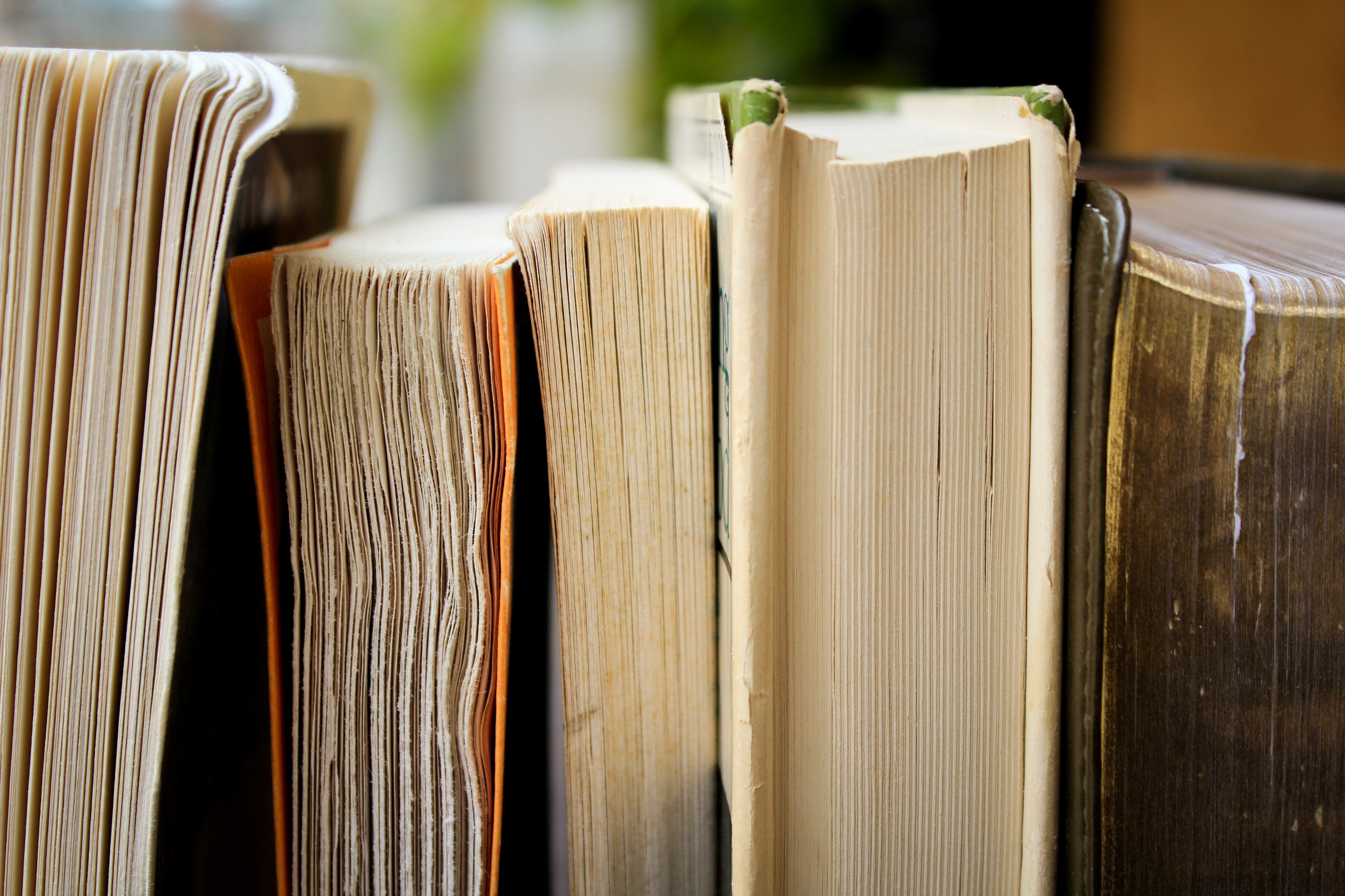 the bottom of five weathered books stacked horizontally next to each other, weathered books 4k, HD Wallpaper