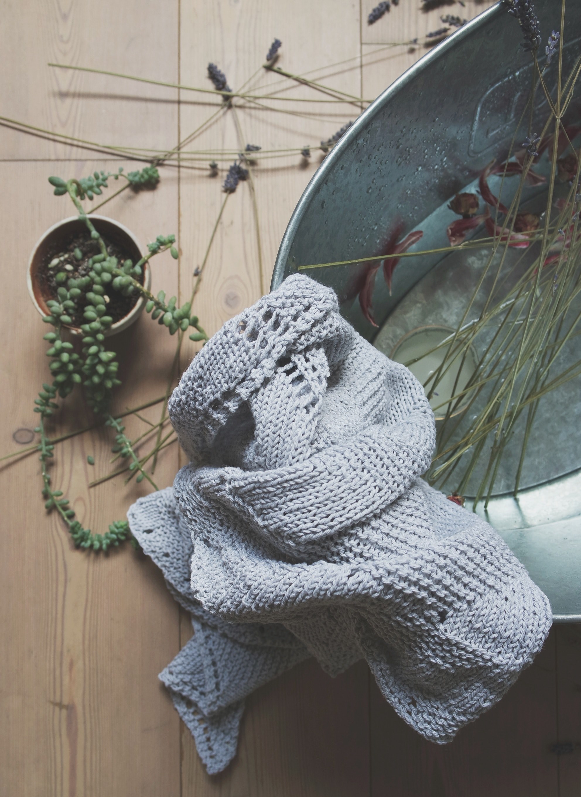a knit scarf on a bucket with flowers next to a potted plant, nature in the home 4k, Phone HD Wallpaper