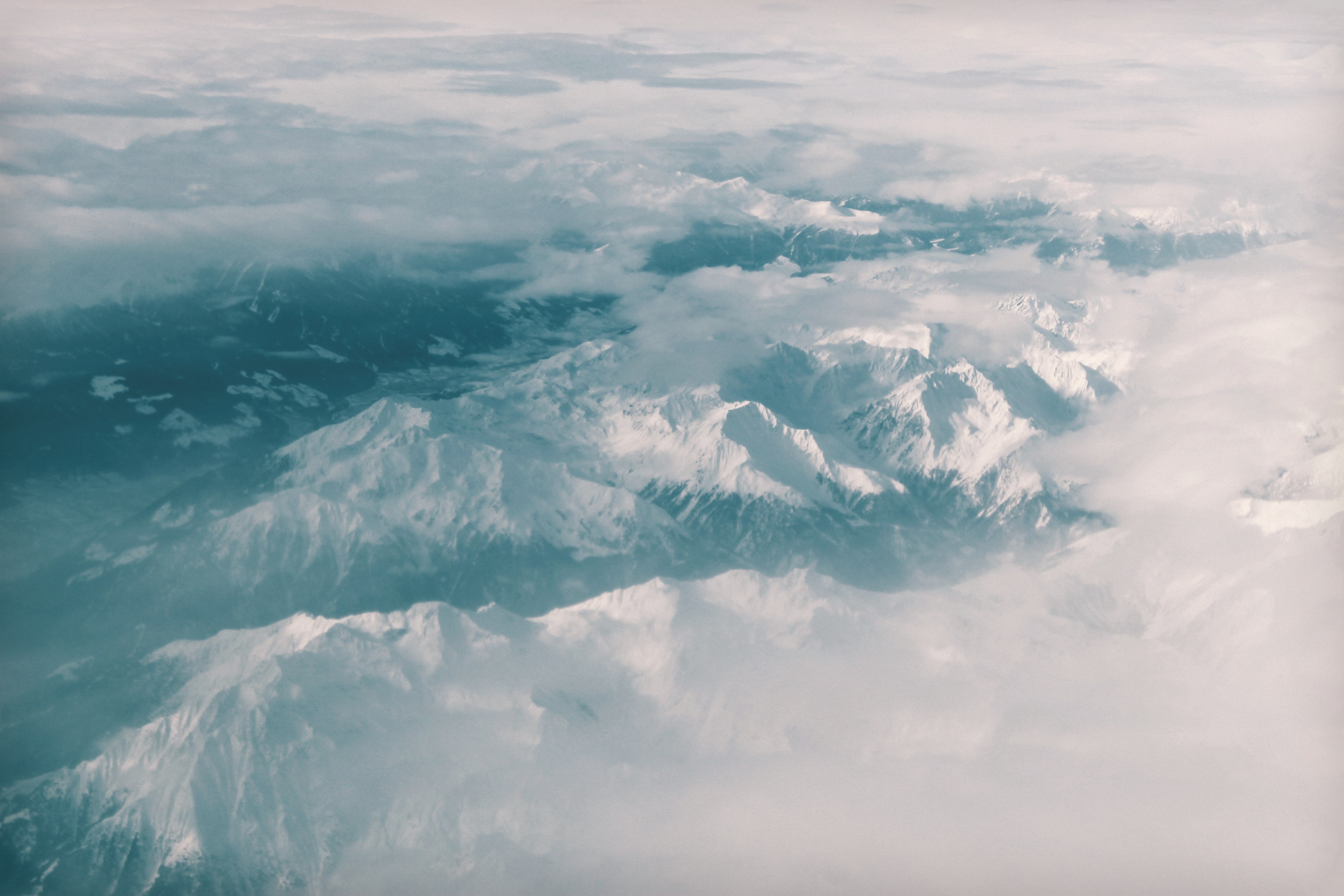 a drone view of the swiss alps snow covered mountains surrounded by fog, _snow covered swiss alps 4k, HD Wallpaper