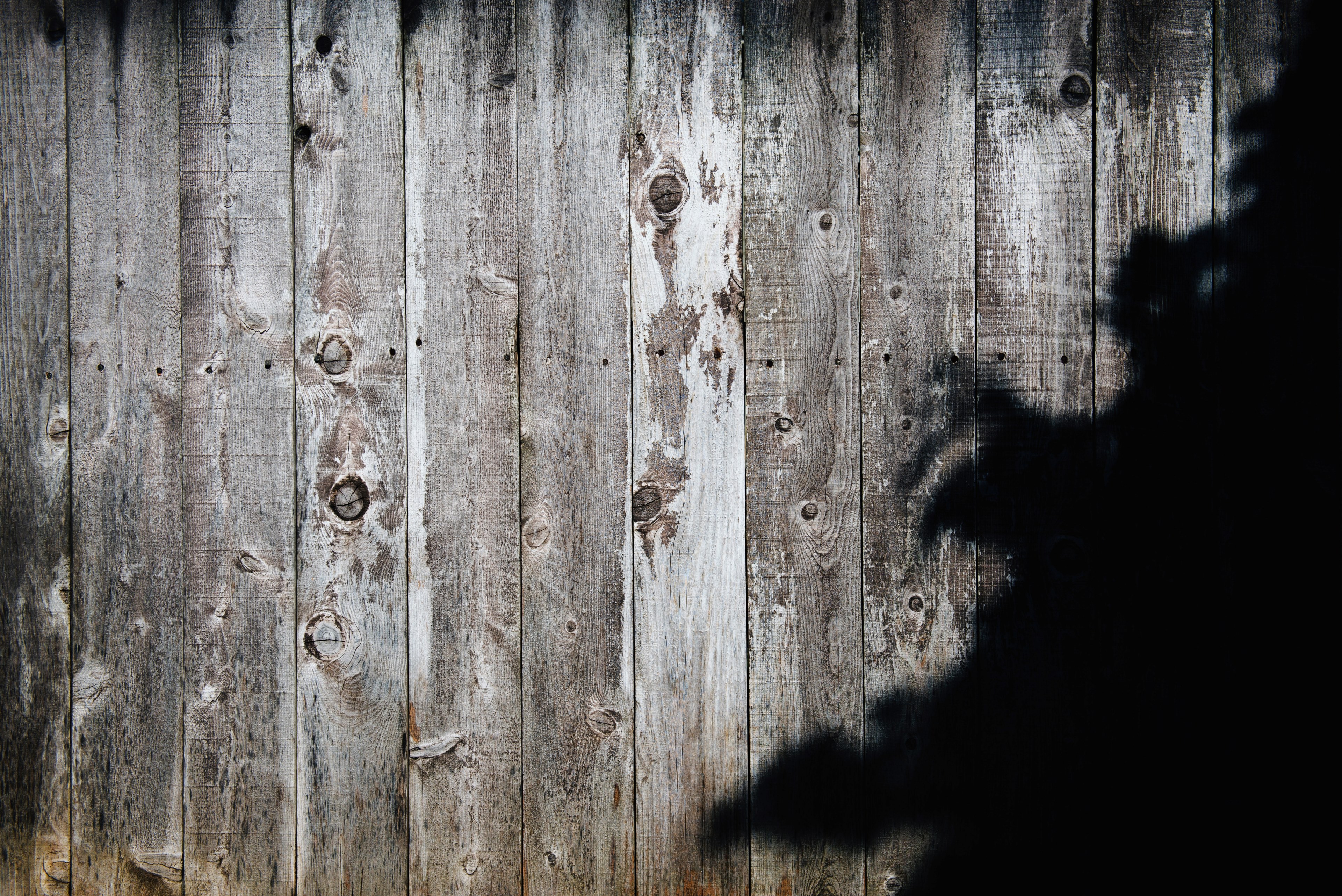 a black shade on a wooden plank wall, fenced in 4k, HD Wallpaper