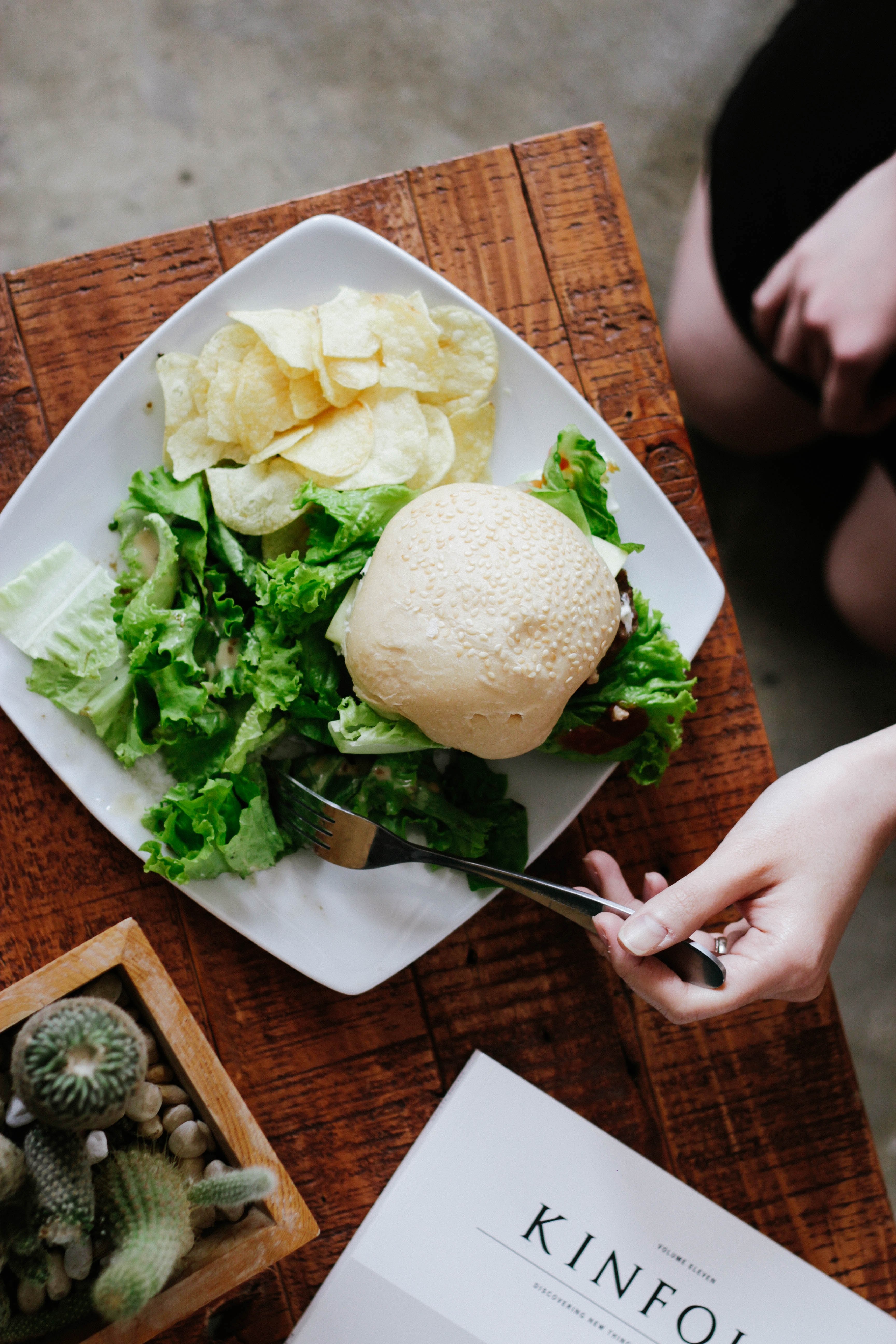 a person eating a meal with a burger green salad and chips, lunch break 4k, Phone HD Wallpaper