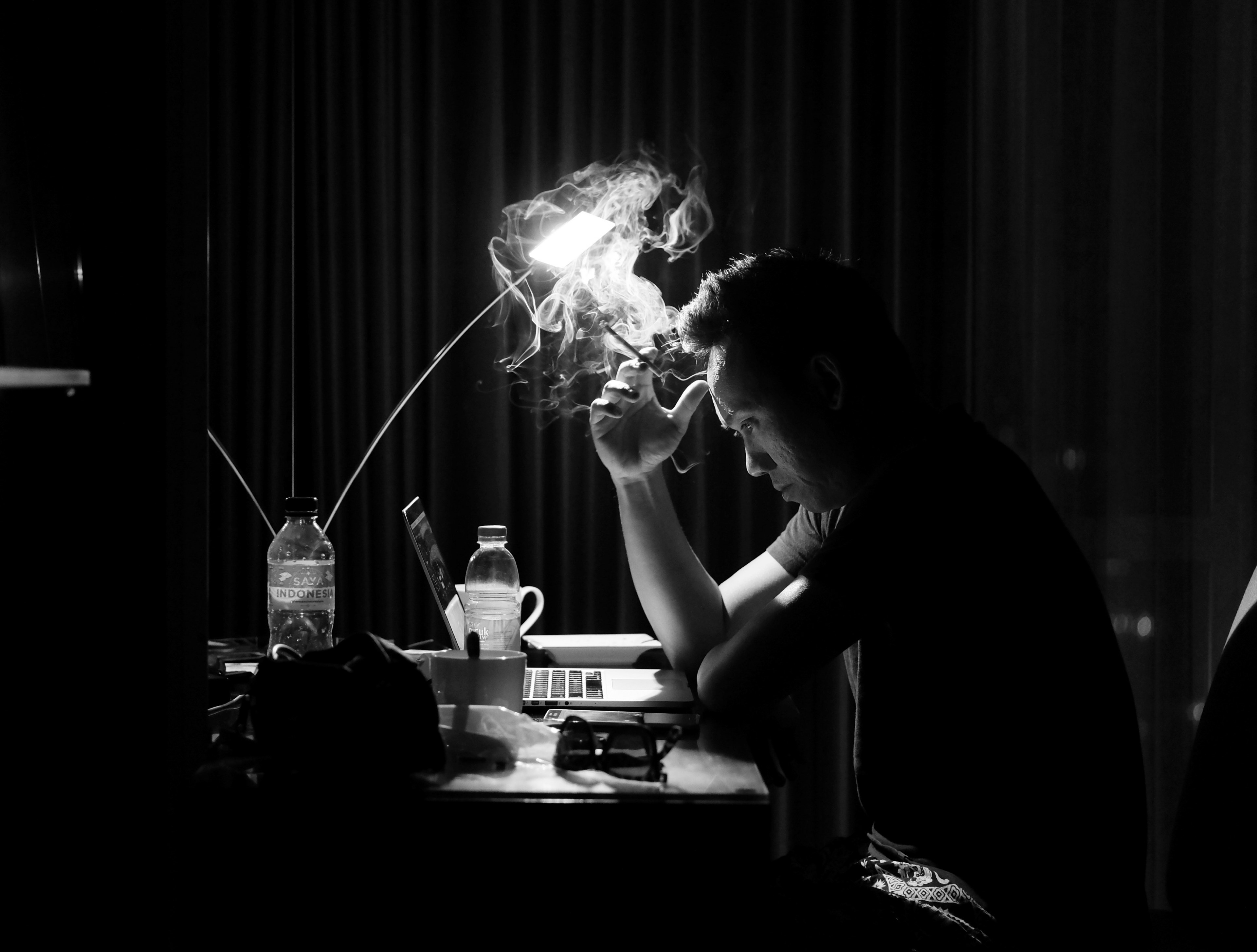 a man sitting at his desk staring at his computer smoking a cigarette, let the heavy thoughts go in smokes 4k, HD Wallpaper