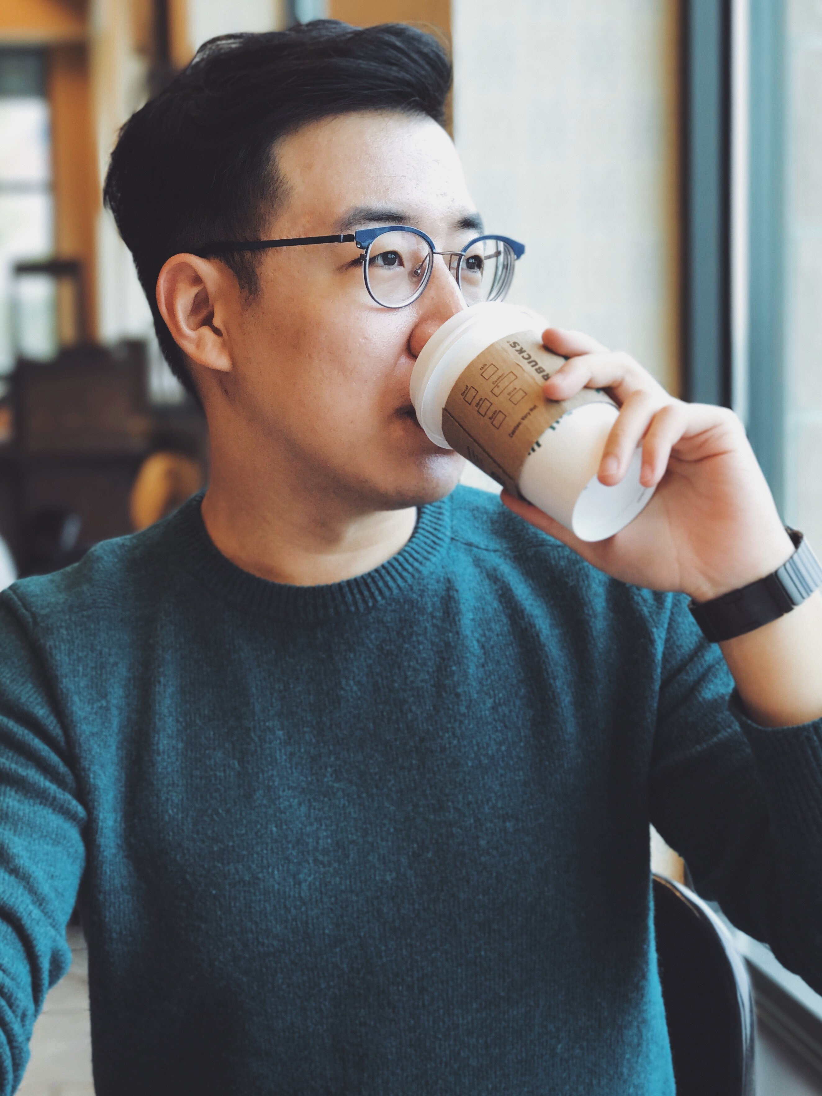man in glasses sipping on a cup of starbucks coffee in a cafe, drinking coffee 4k, Phone HD Wallpaper