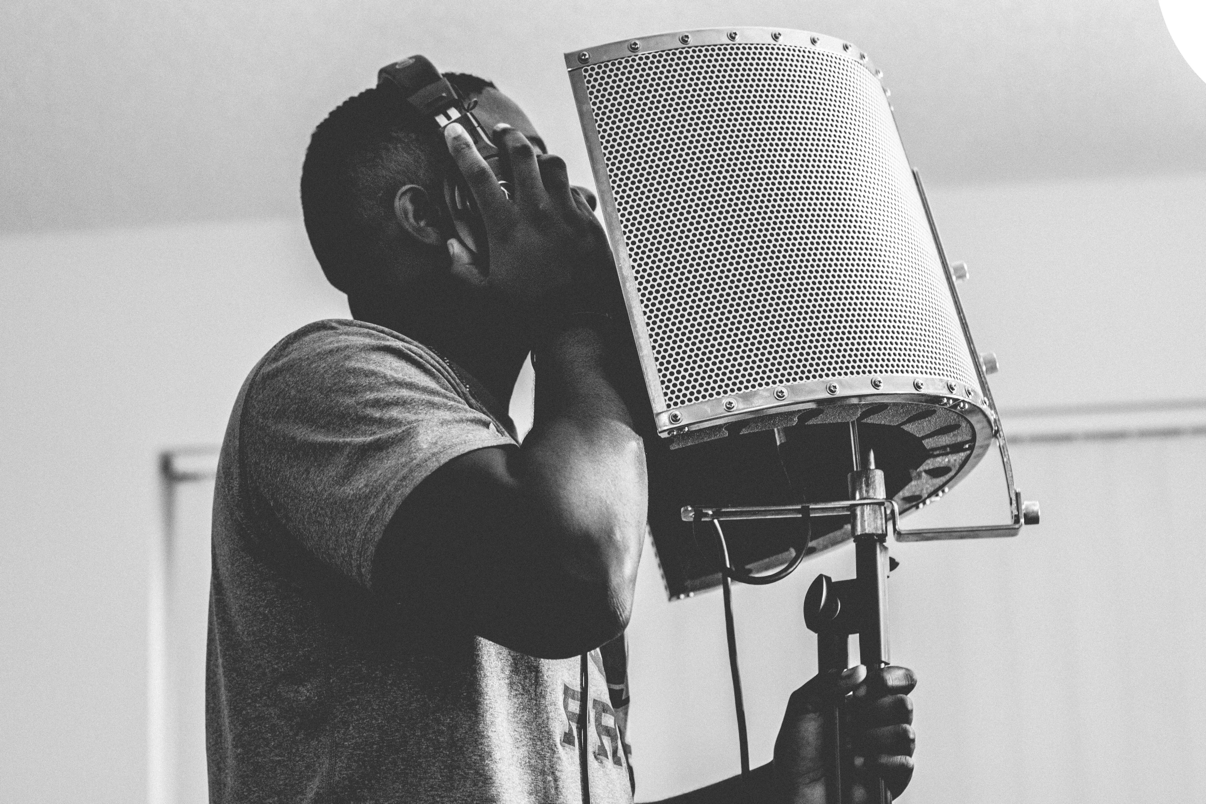 man in a t shirt and headphones singing in the studio microphone at daytona beach, daytona beach recordings 4k, HD Wallpaper