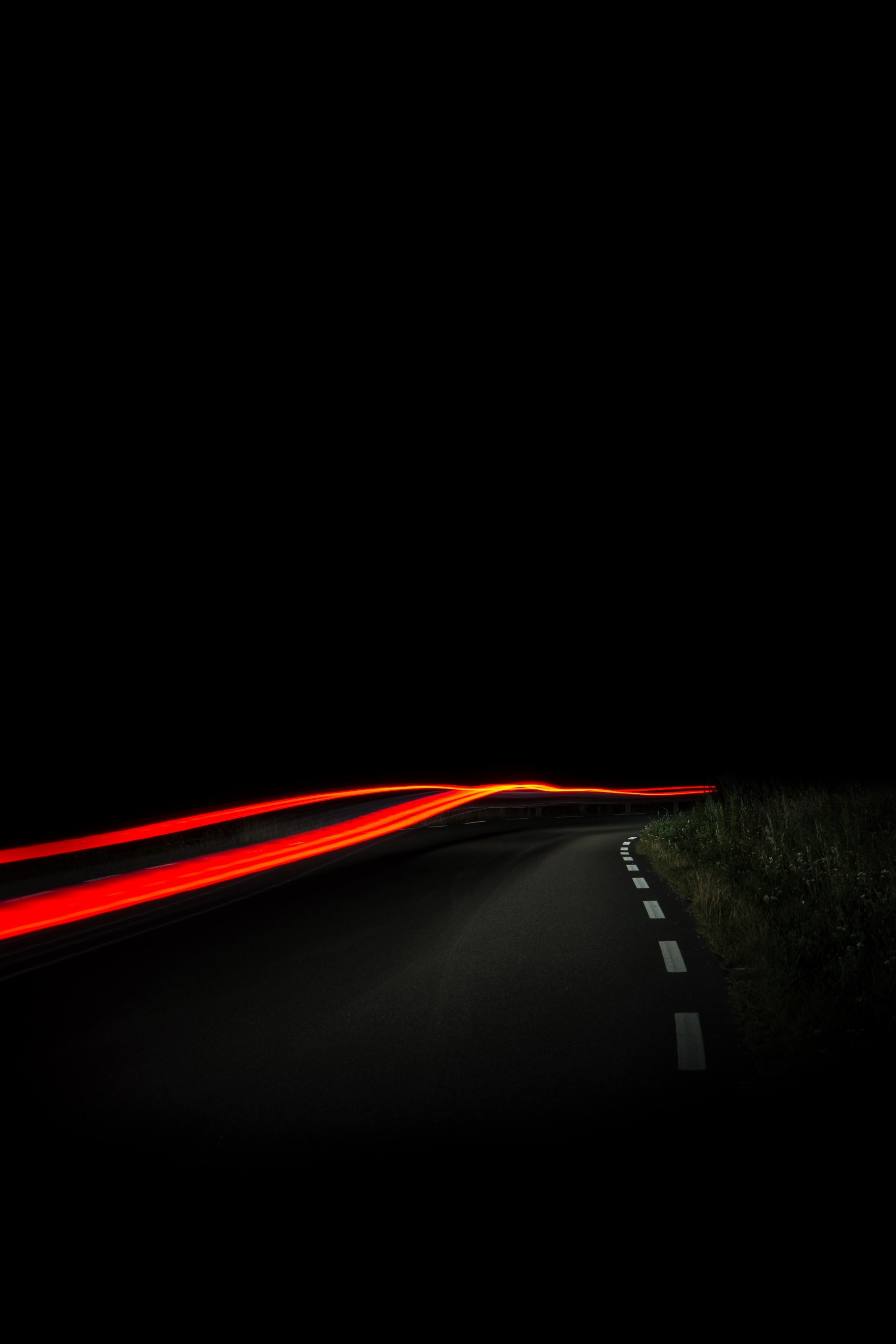 a blurry night time shot of a road in sa with red car trails amidst the streets darkness, sa street light trail at night 4k, Phone HD Wallpaper
