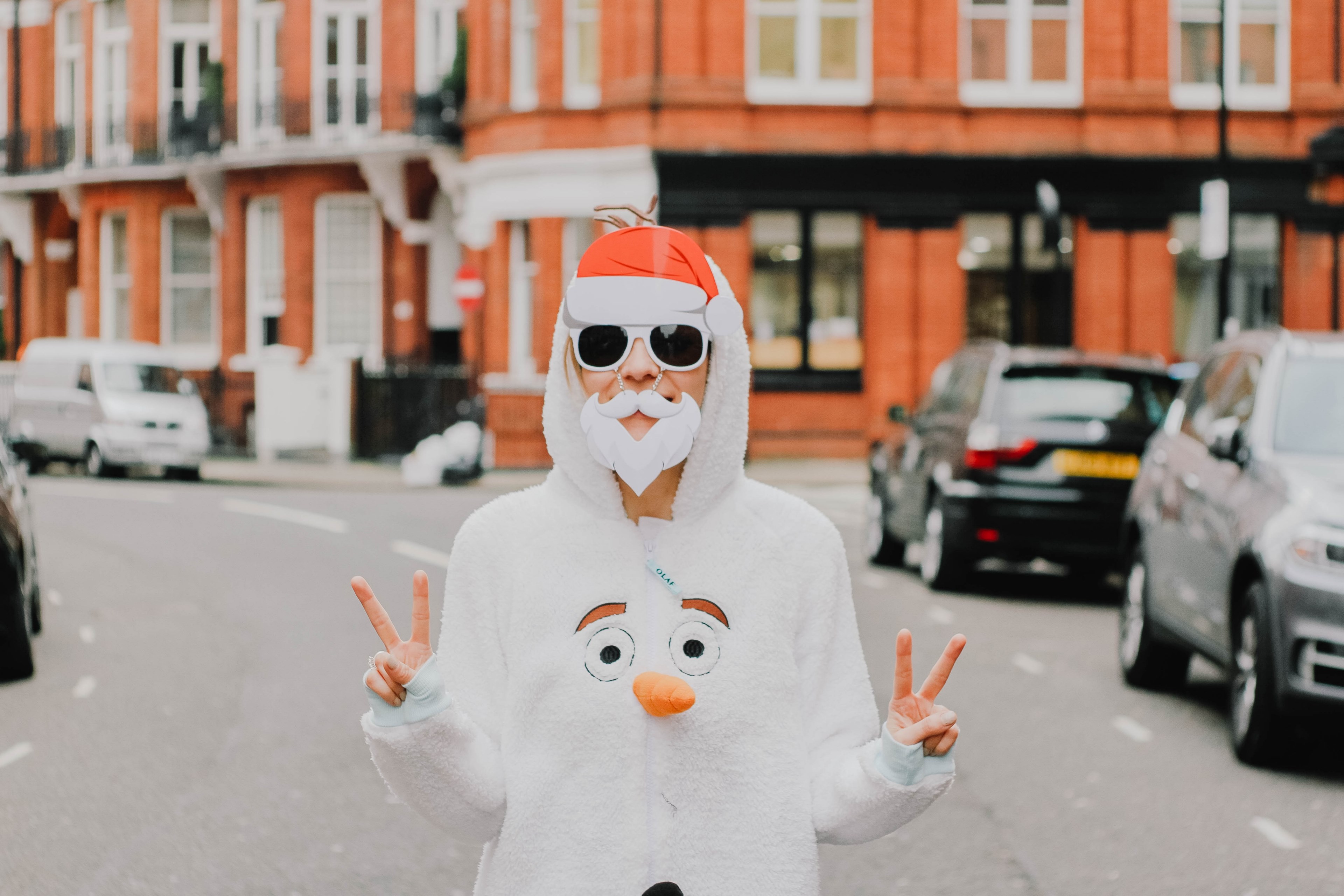 a person wearing a fake white beard and santa hat with a jumper suit that features a snowmans face on the chest, _olaf 4k, HD Wallpaper