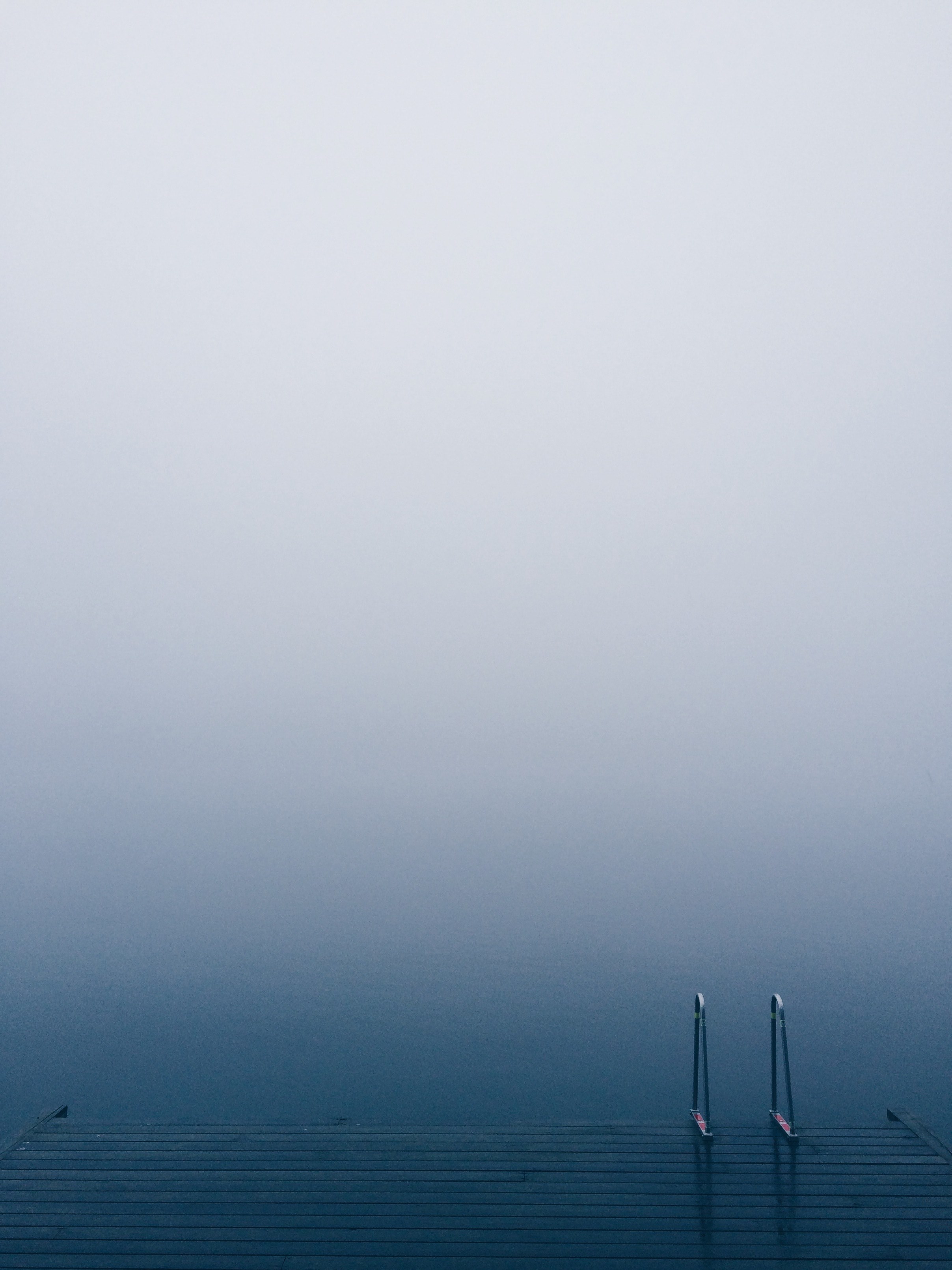 lake pier with a ladder on serene waters on a foggy day, a dock during winter 4k, Phone HD Wallpaper