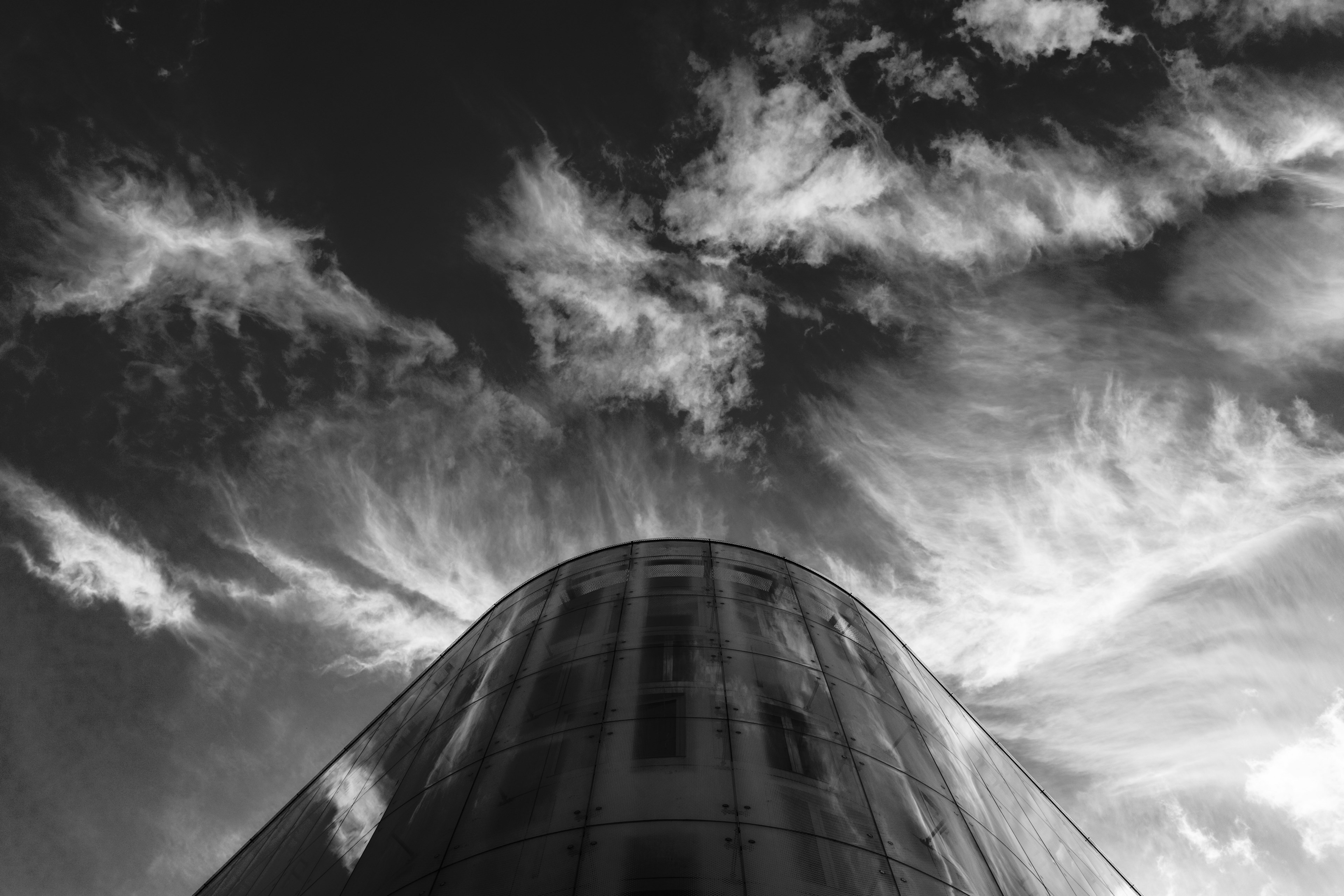 black and white below shot of building glass architecture with cloudy sky in soho, glass building wall in soho 4k, HD Wallpaper