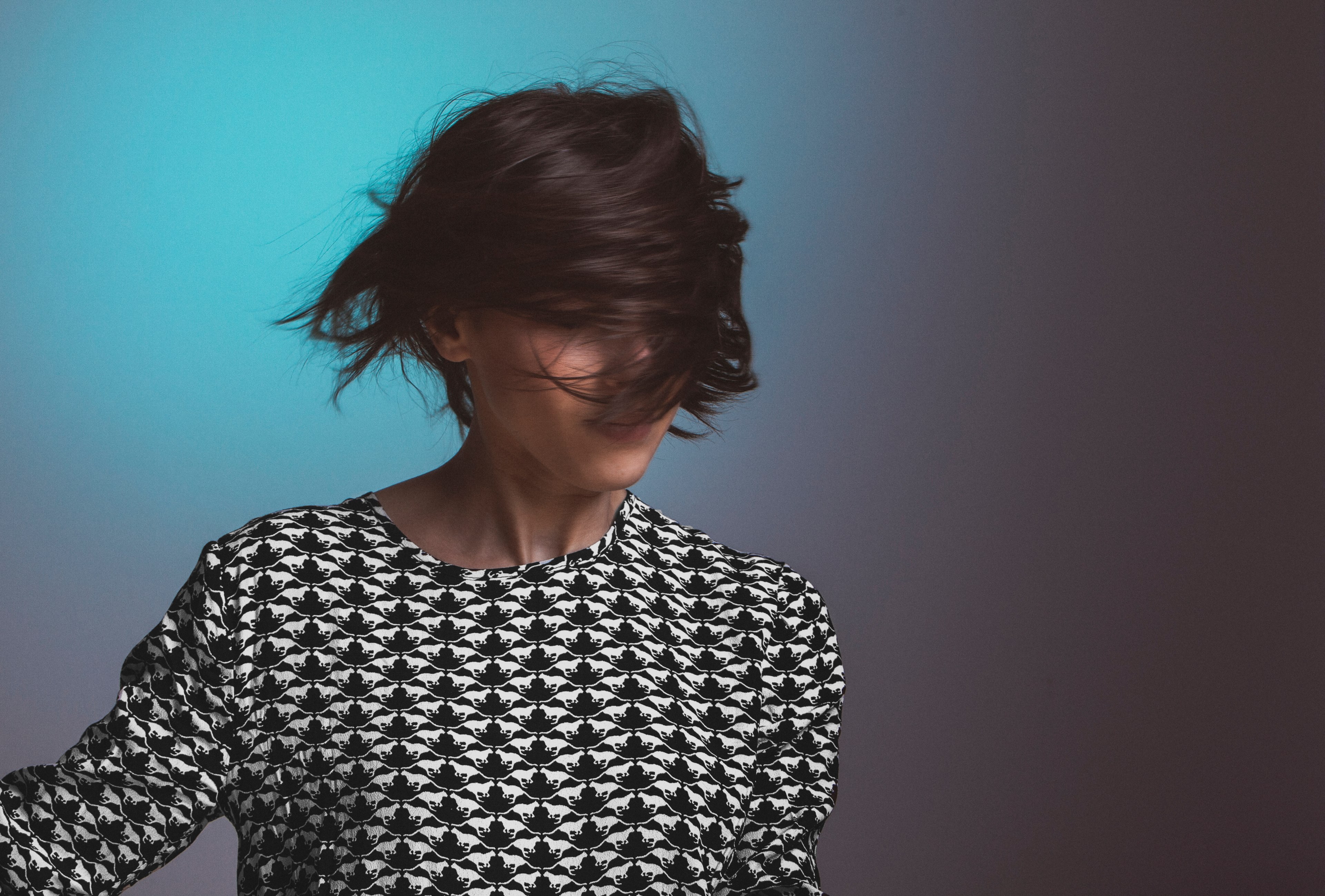 woman wearing a patterned sweater flips her short hair in front of her face, music and cats 4k, HD Wallpaper
