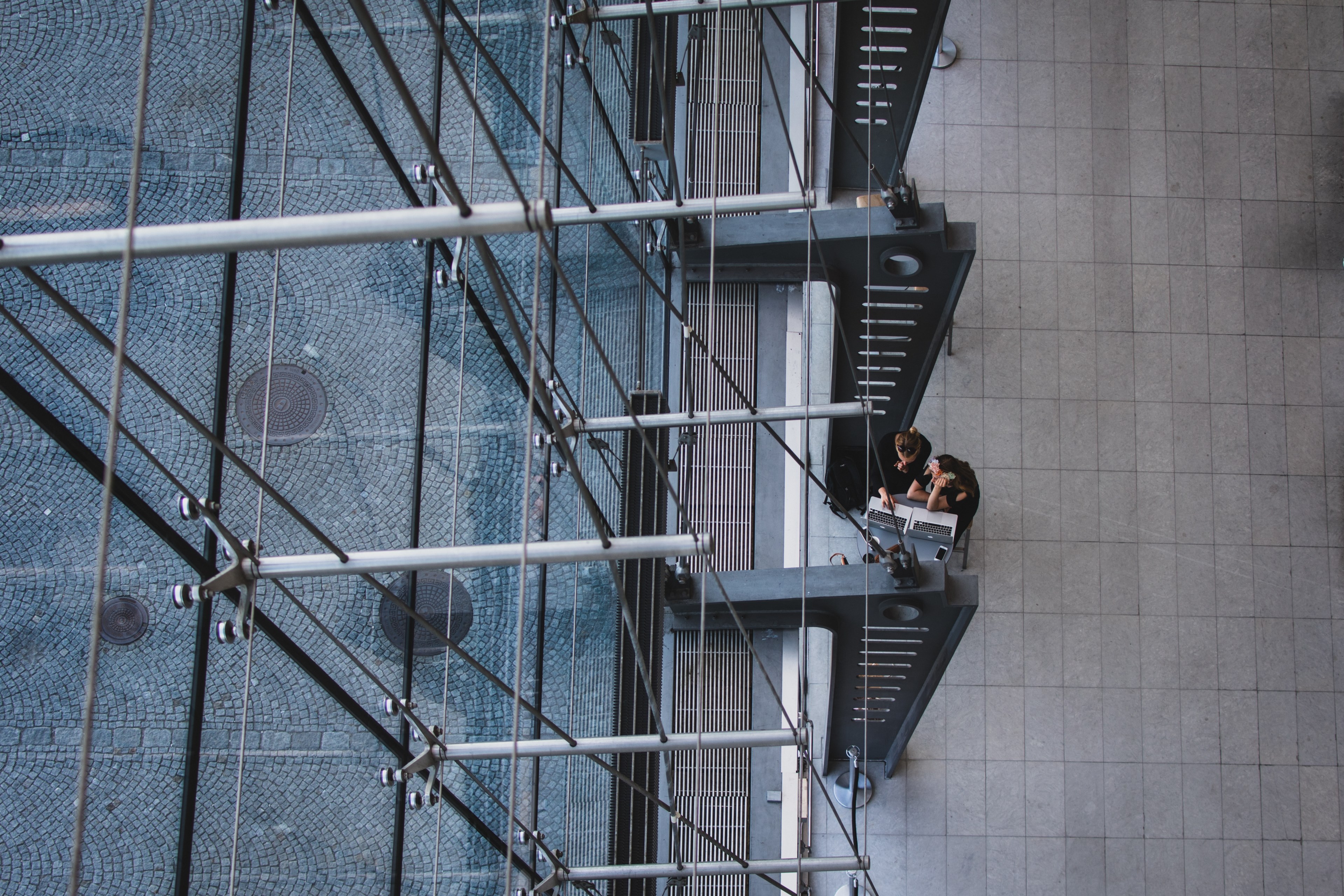 an overhead shot of two people working at laptops in the royal library, the break 4k, HD Wallpaper