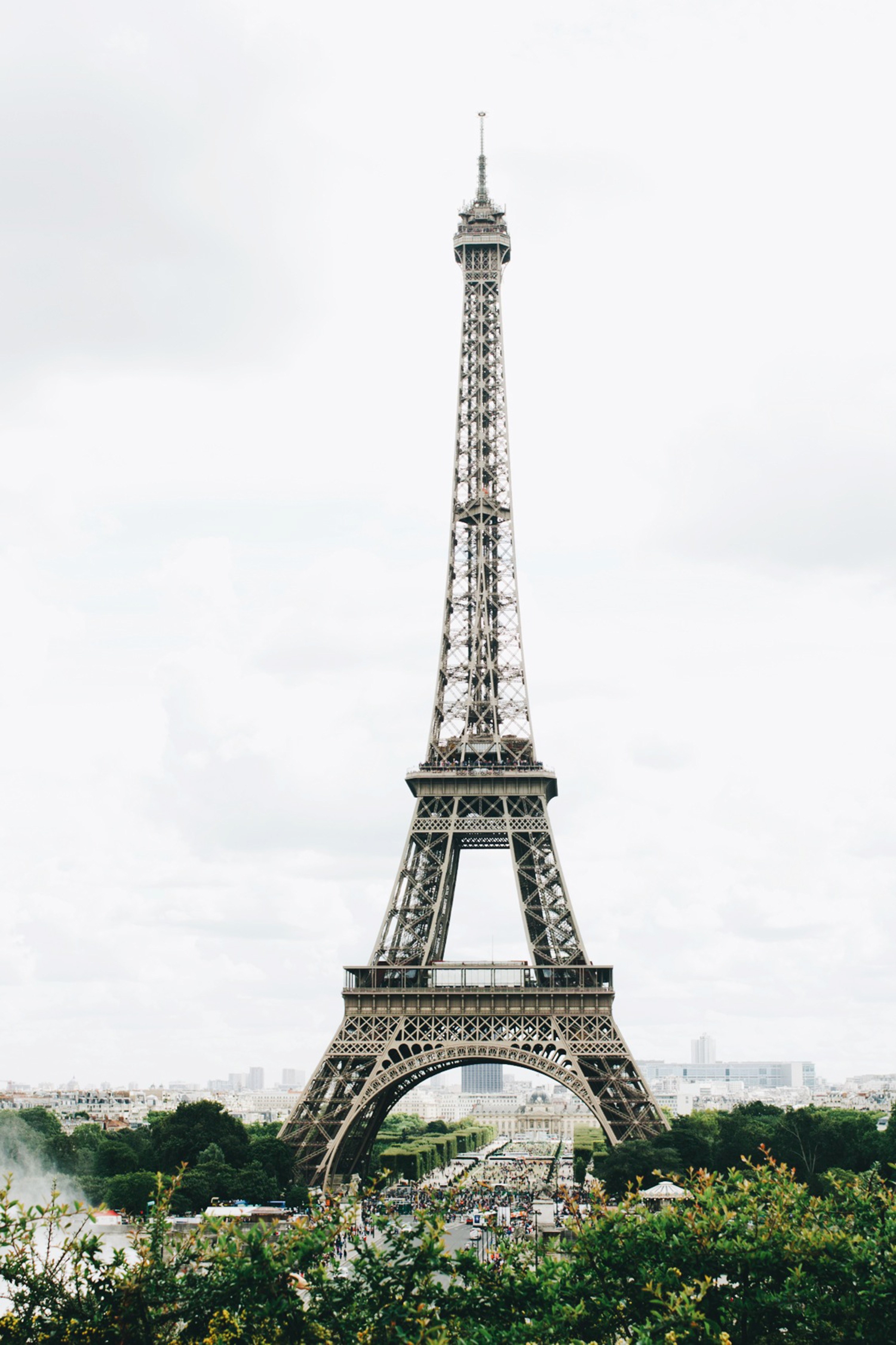 the eiffel tower on a cloudy day in paris, eiffel tower of paris 4k, Phone HD Wallpaper