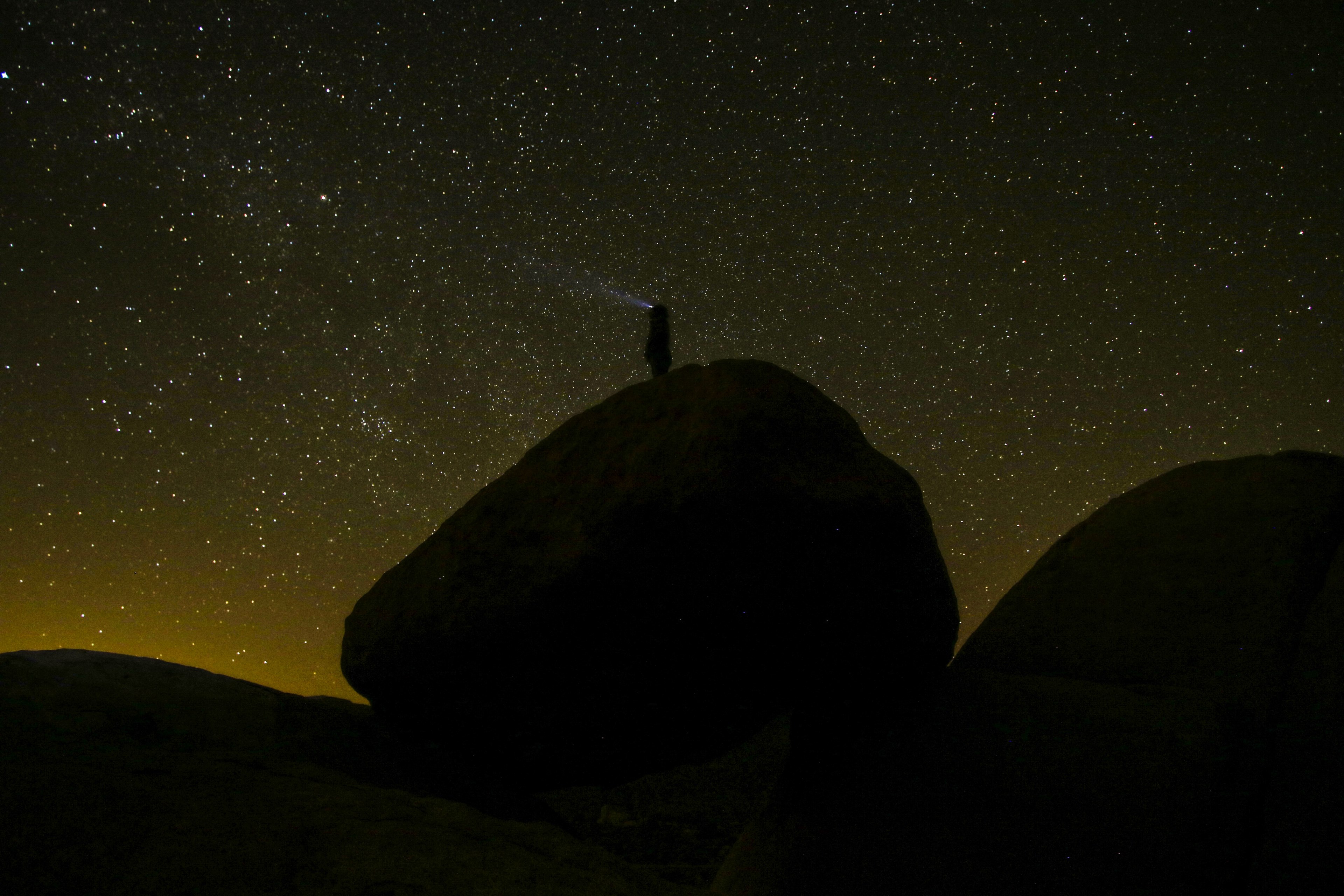 rock standing torch light and flash light 4k, HD Wallpaper