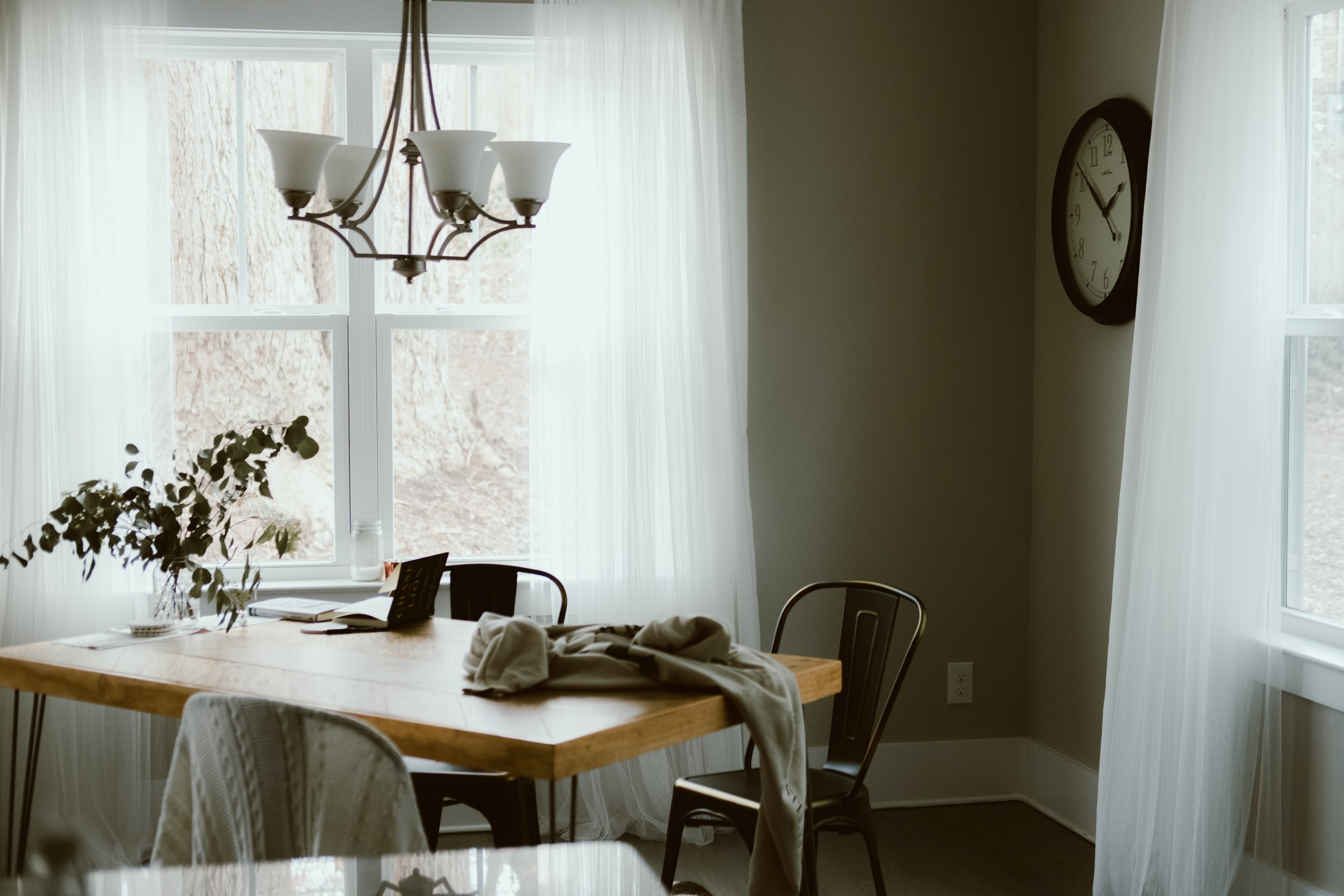 a dining room with a table chairs plants clock curtains and light fixture in charlotte, new home 4k, HD Wallpaper
