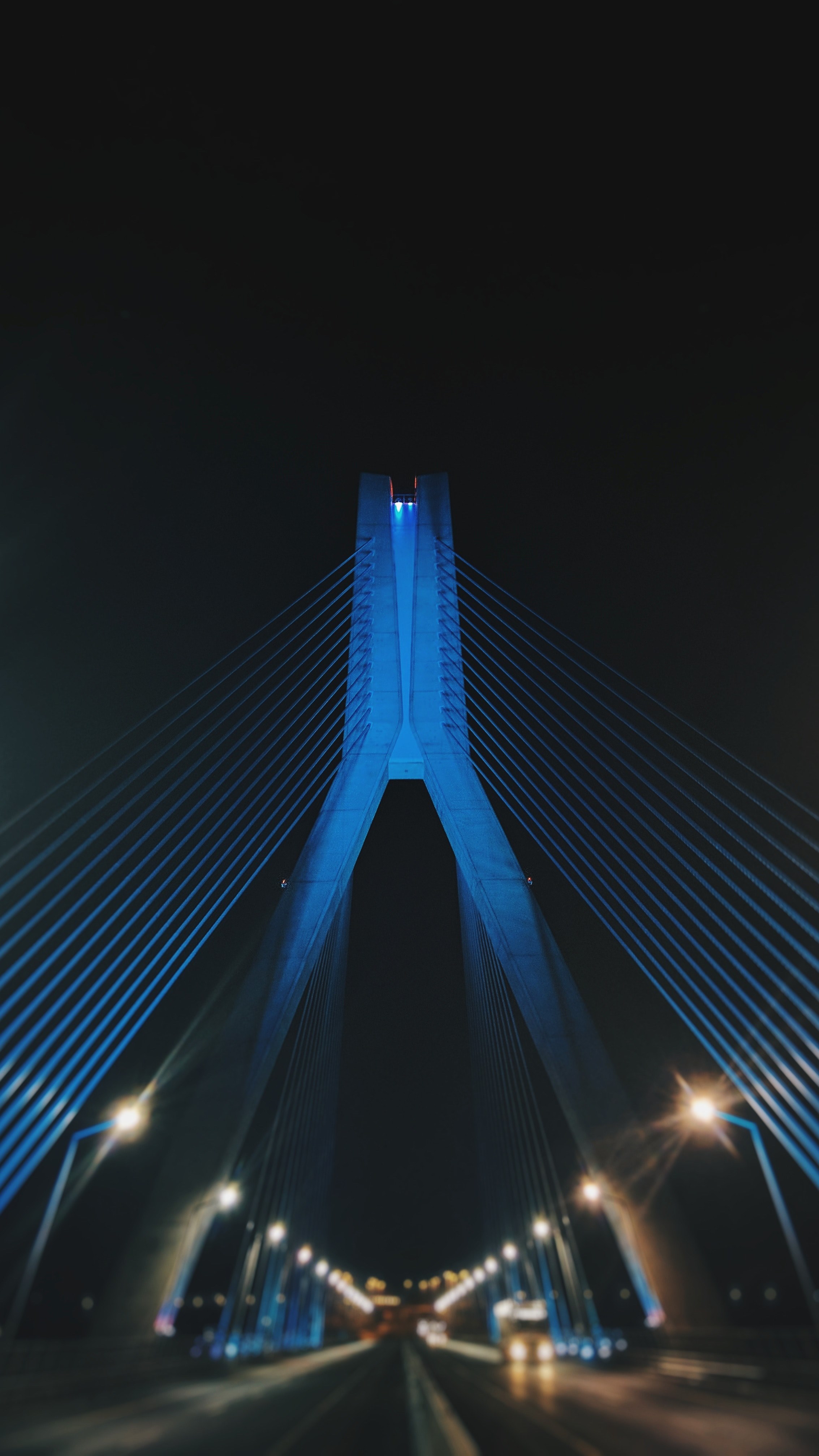 a blue illuminated bridge at night across a street full of lanterns, driving through a bridge at night 4k, Phone HD Wallpaper