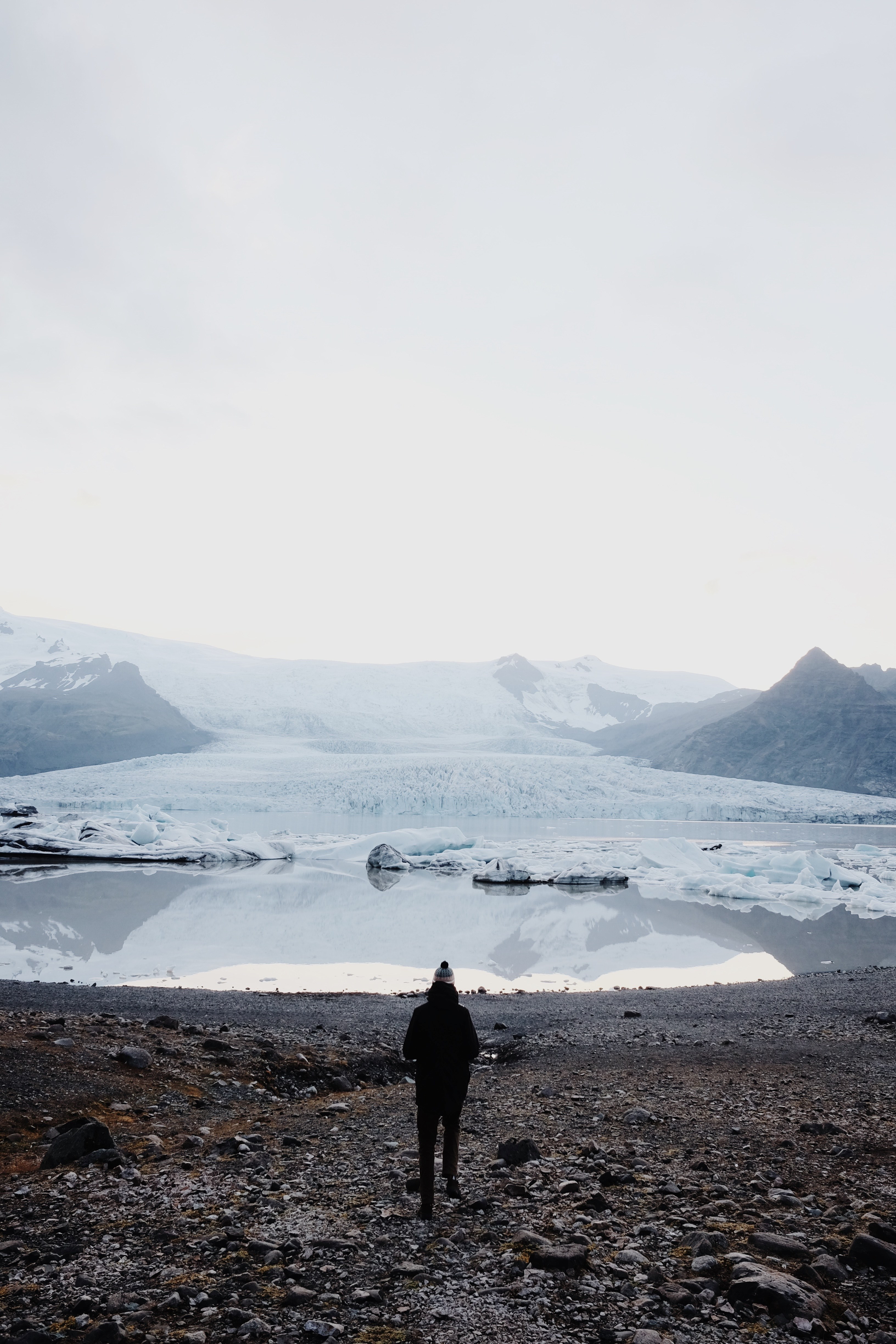 a person looking at a snow covered mountain pond, _glacier 4k, Phone HD Wallpaper