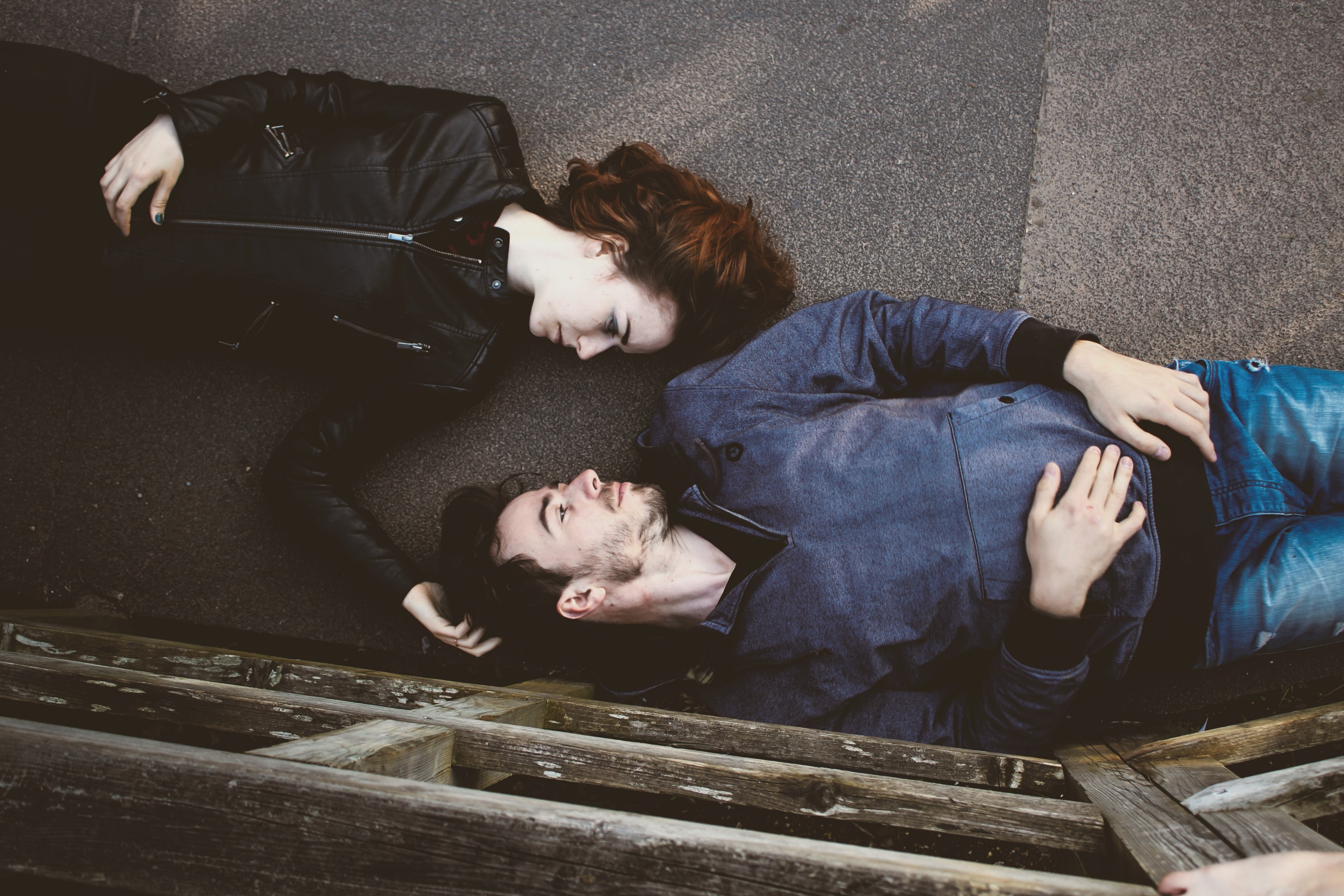 overhead shot of man and woman laying on backs on walkway outdoors, i could fall asleep here 4k, HD Wallpaper