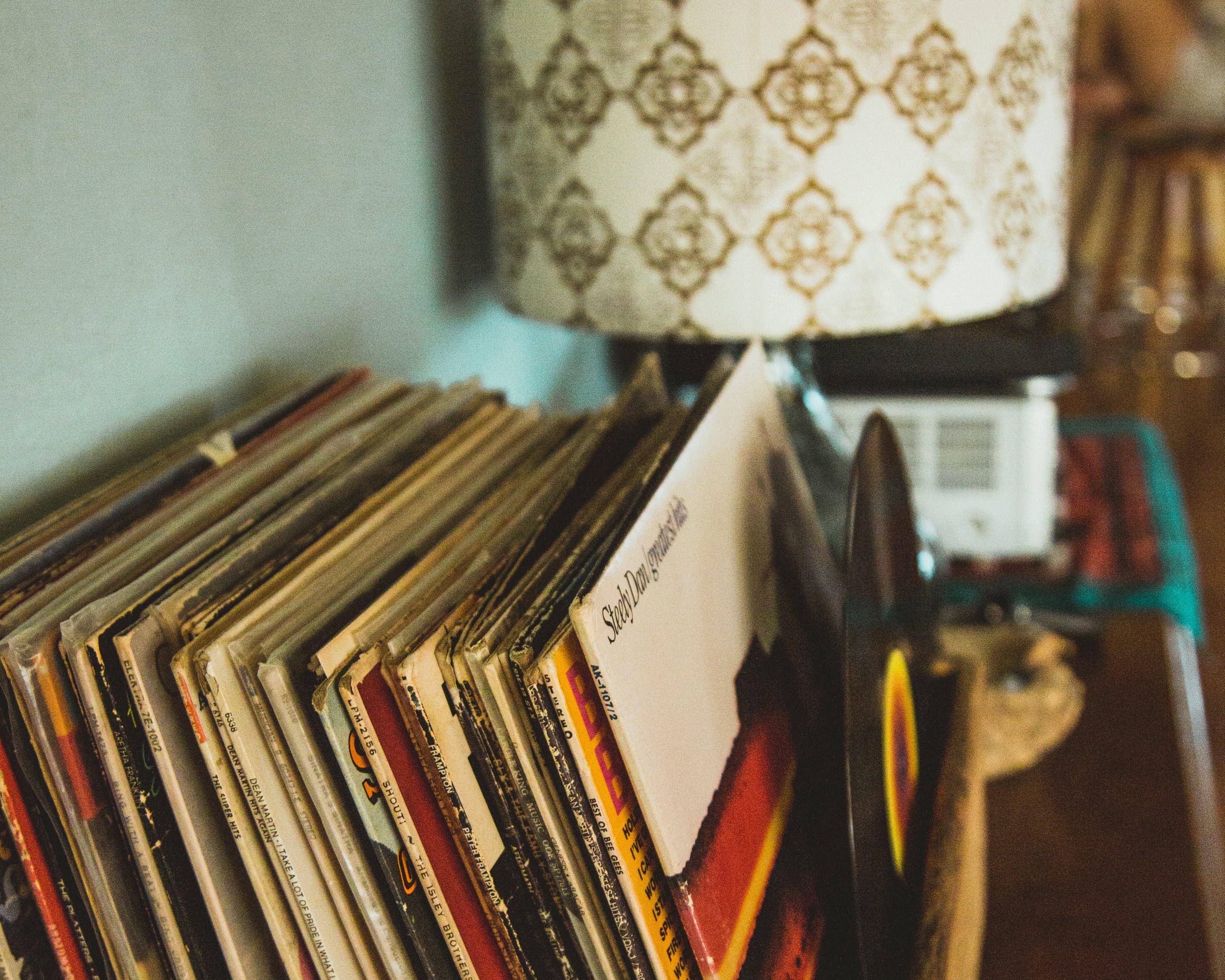 a collection of vintage records and a retro lamp, records in the desert 4k, HD Wallpaper