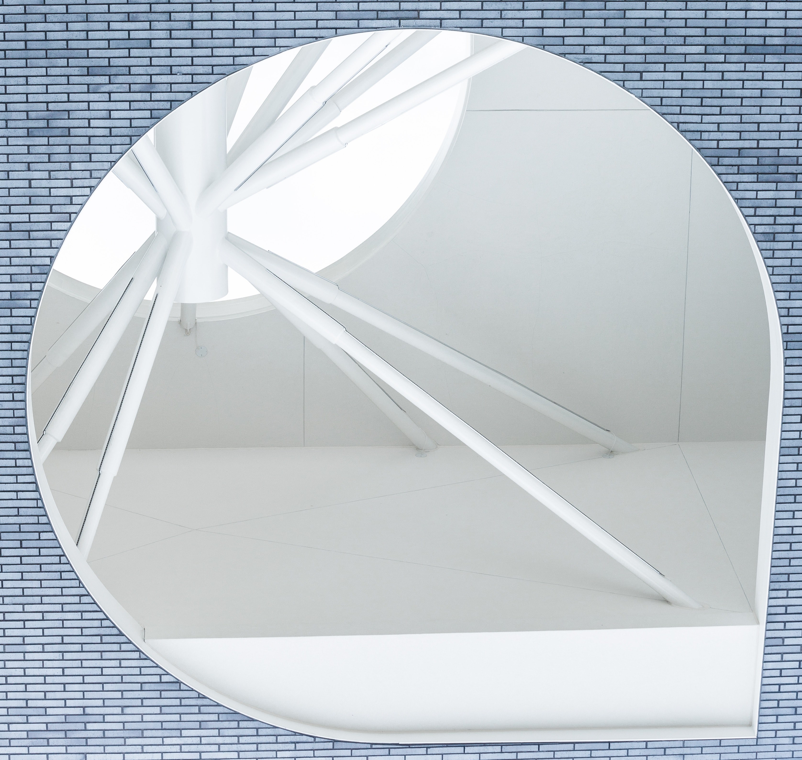 white concentric metal poles seen through a gap in a blue brick wall, learn to see differently 4k, HD Wallpaper