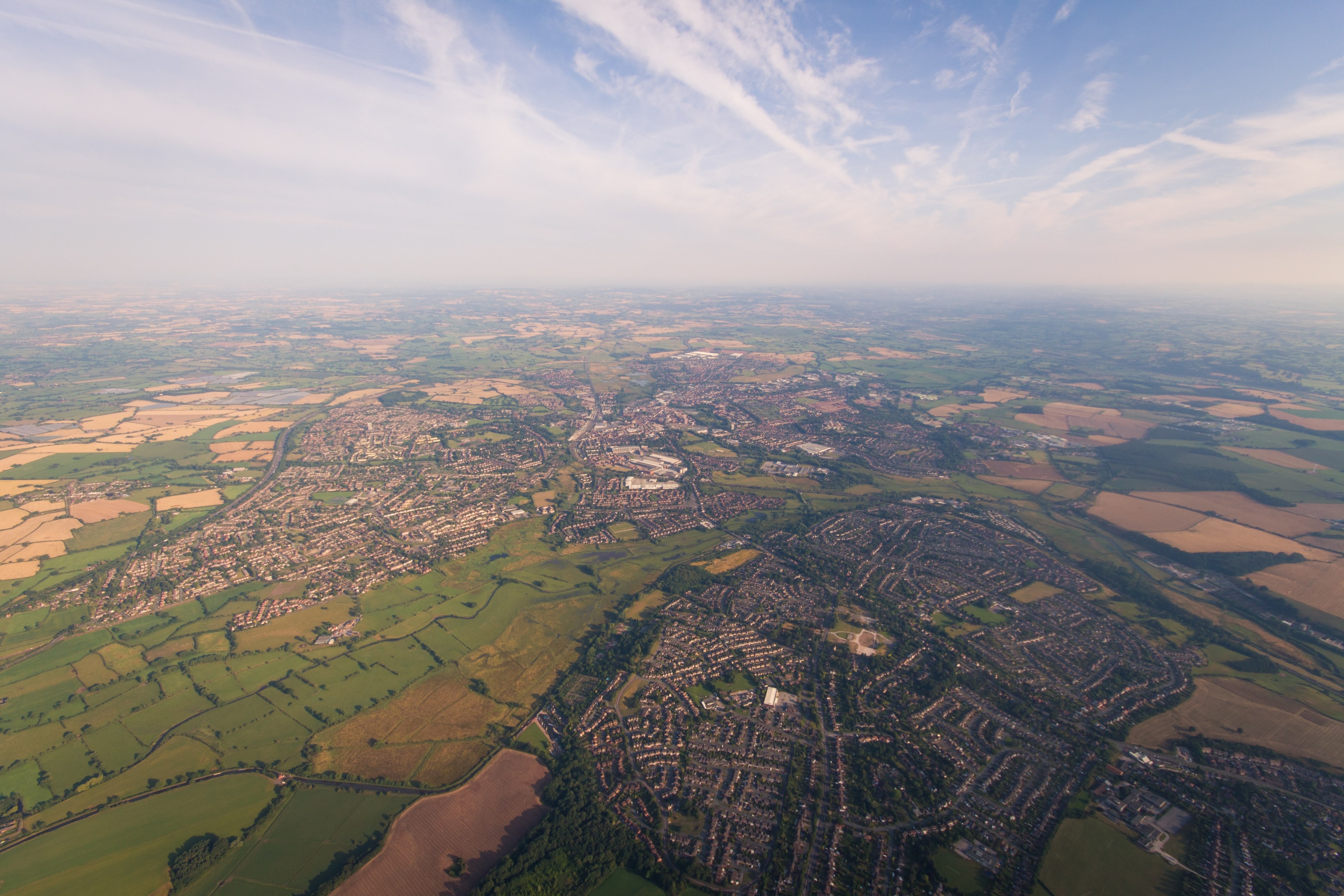 rural towns form maze like patterns in a country landscape, above a countryside town 4k, HD Wallpaper