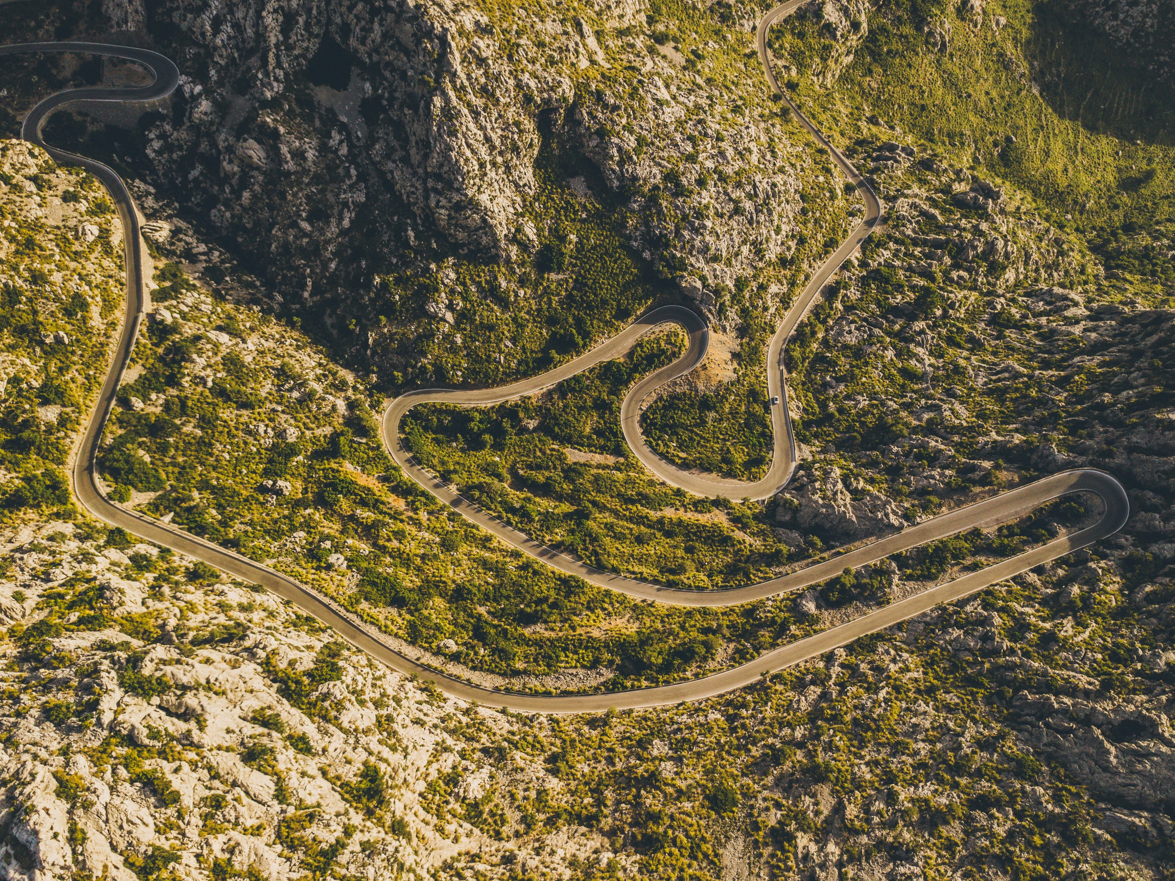 an aerial view of a large curvy road traveling through country mountains, _road to sa calobra 4k, HD Wallpaper