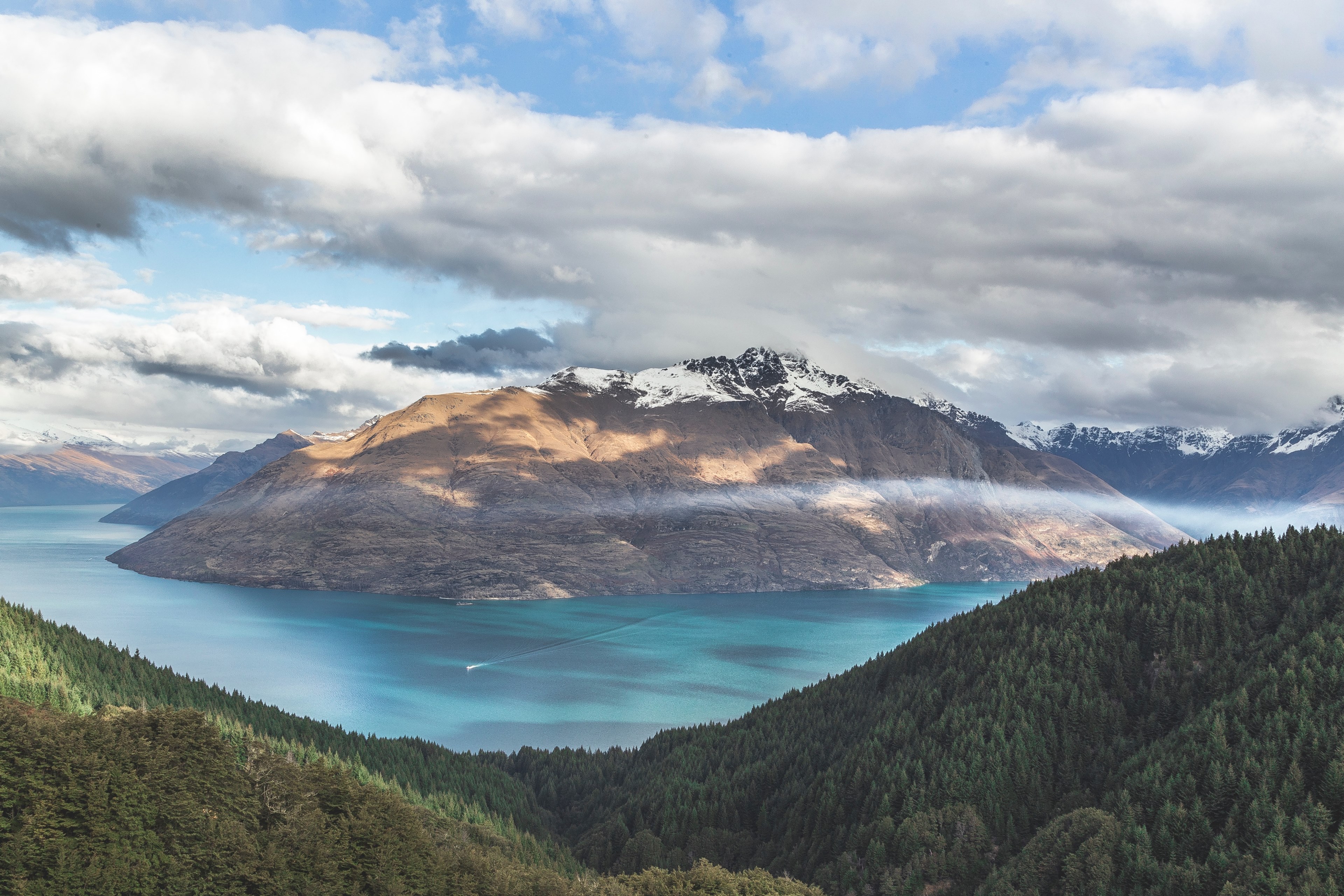a large azure lake amid snow capped mountains and wooded hills, blue lake and white peaks 4k, HD Wallpaper