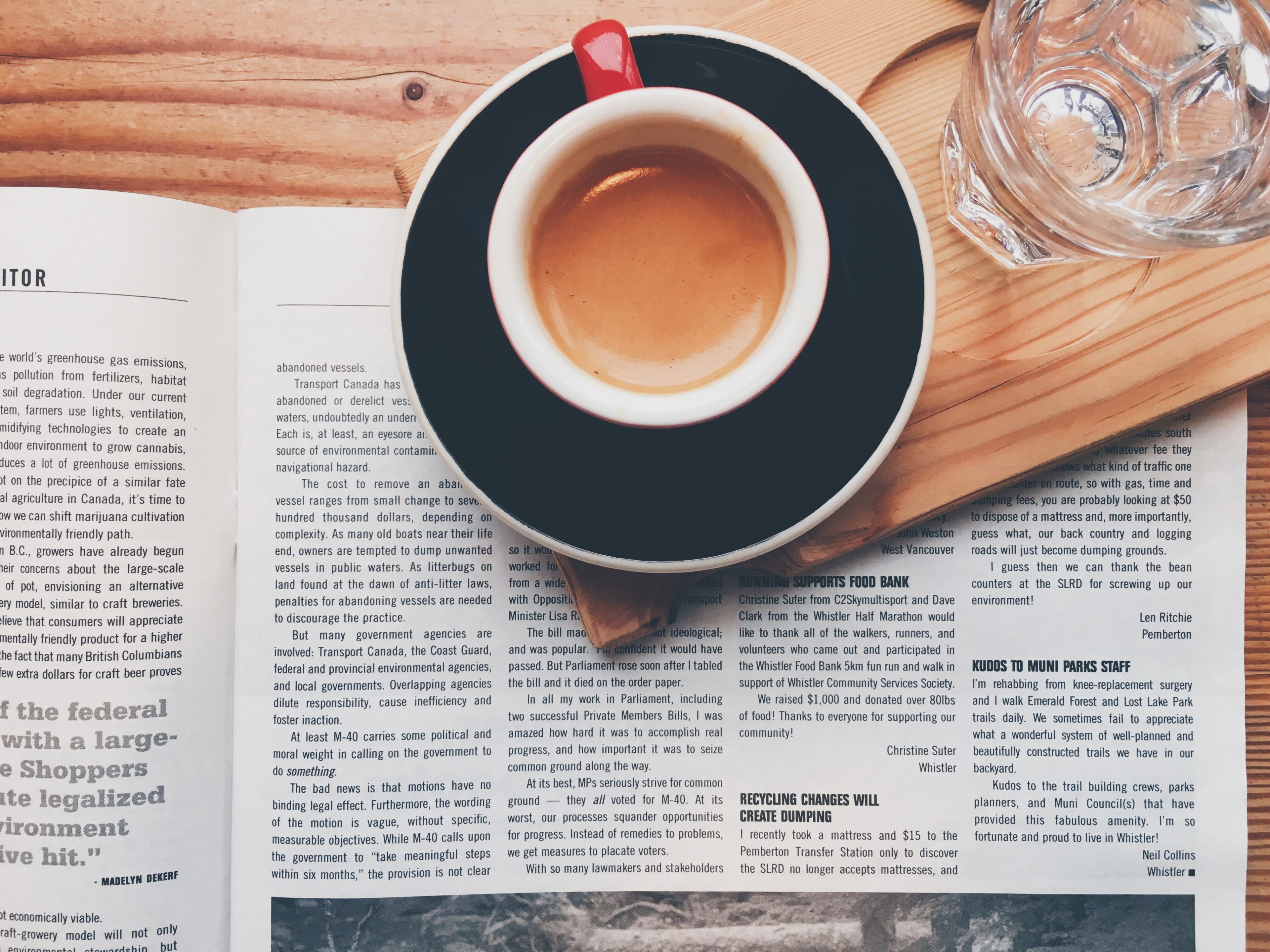a cup of espresso in a red mug on a wooden coaster with a glass of water on top of a magazine, espresso 4k, HD Wallpaper
