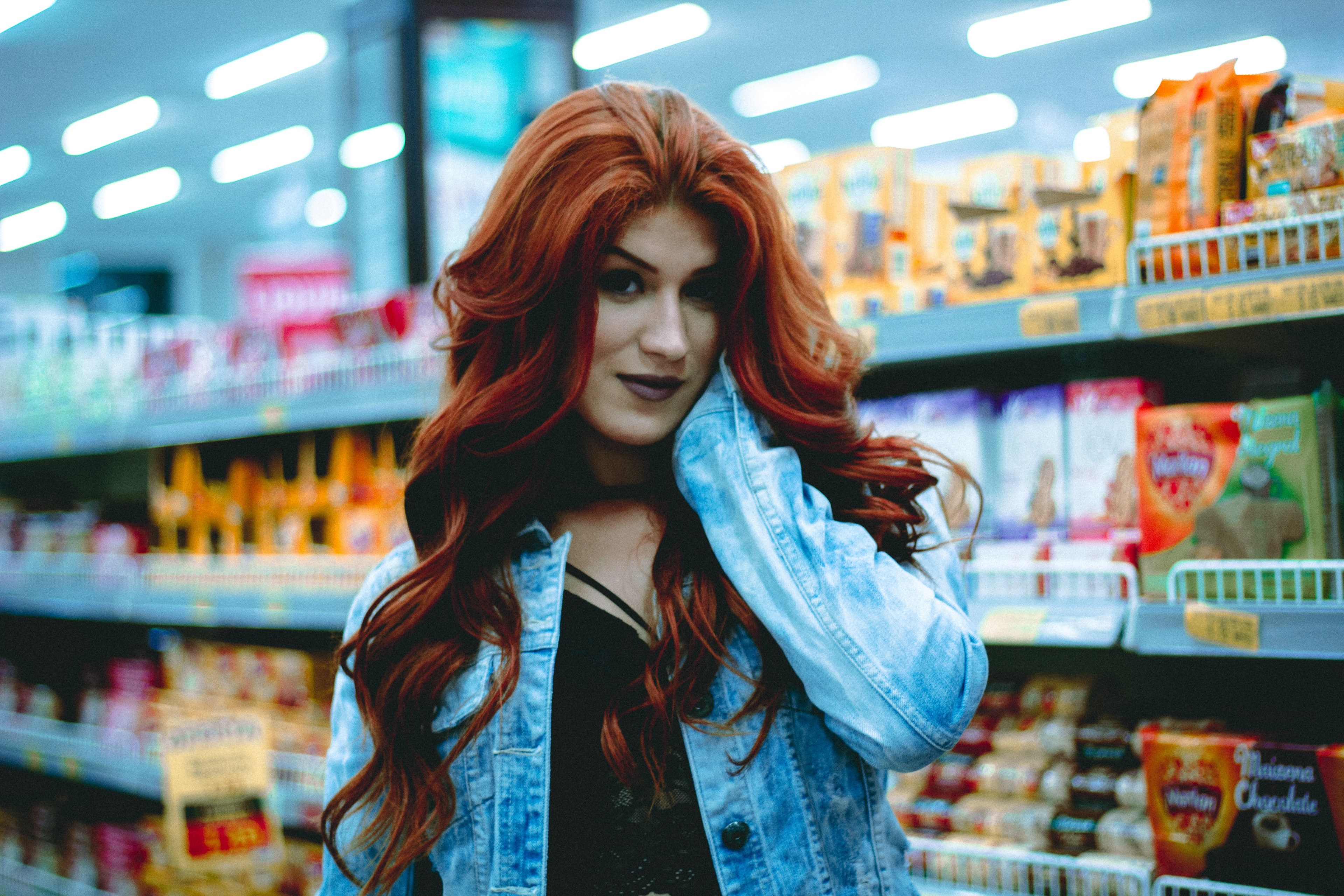 woman with long red hair poses in a grocery store candy aisle, glamorous grocery shopping 4k, HD Wallpaper