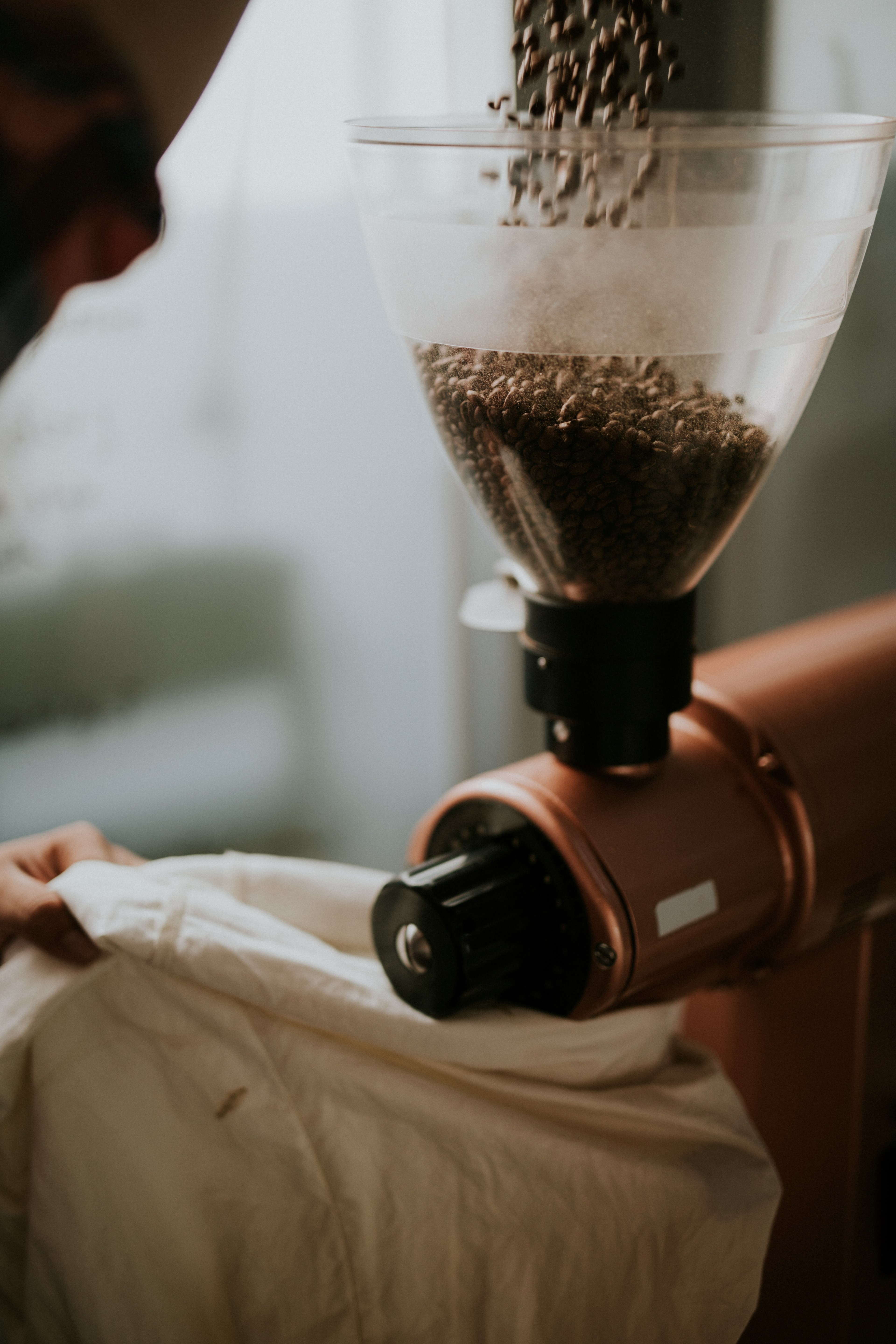 pouring coffee beans into a grinder in a cafe kitchen, just grind it out 4k, Phone HD Wallpaper
