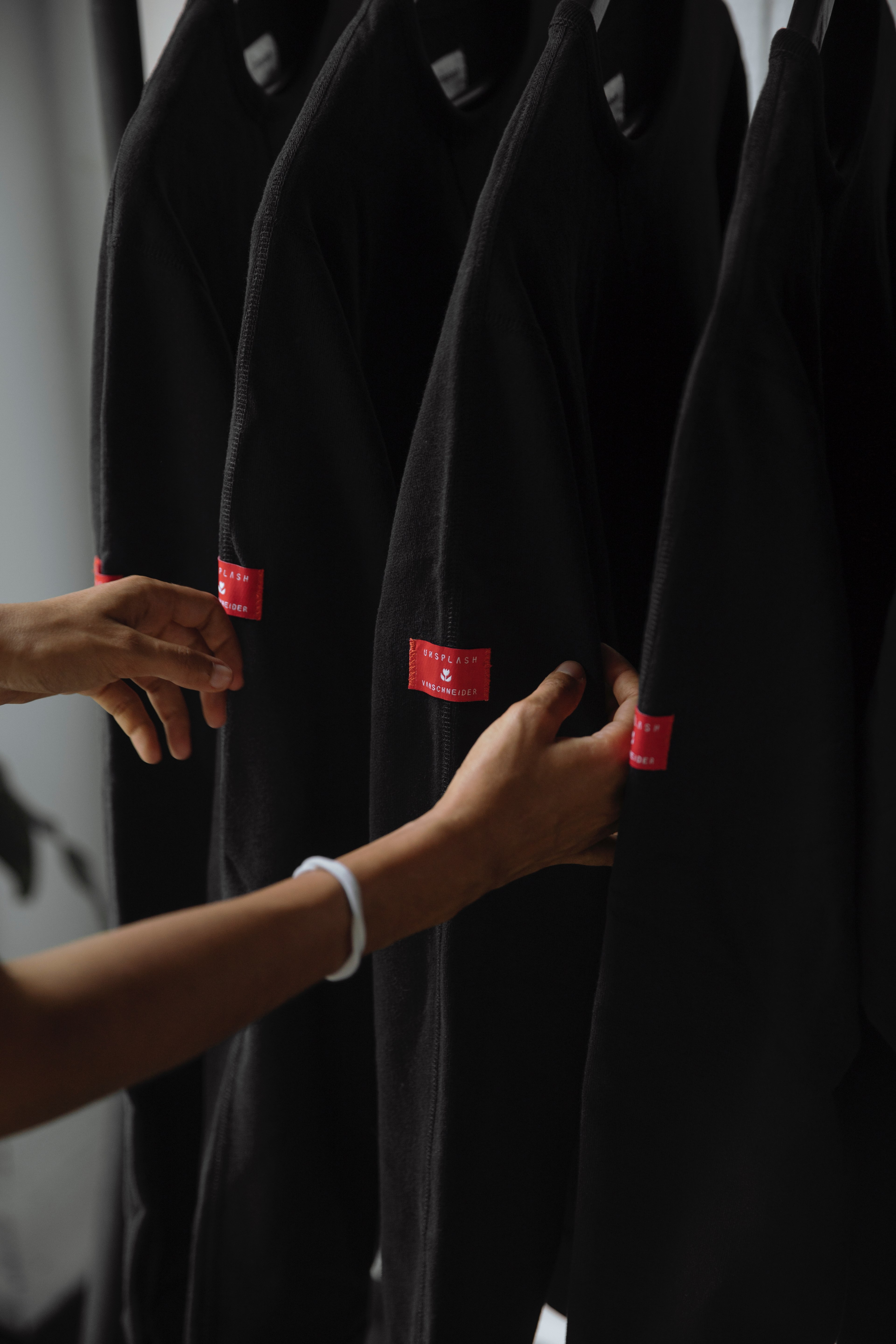 a pair of womans hands is checking the unsplash vanschneider explorer sweatshirts, _the urban explorer sweatshirt 4k, Phone HD Wallpaper