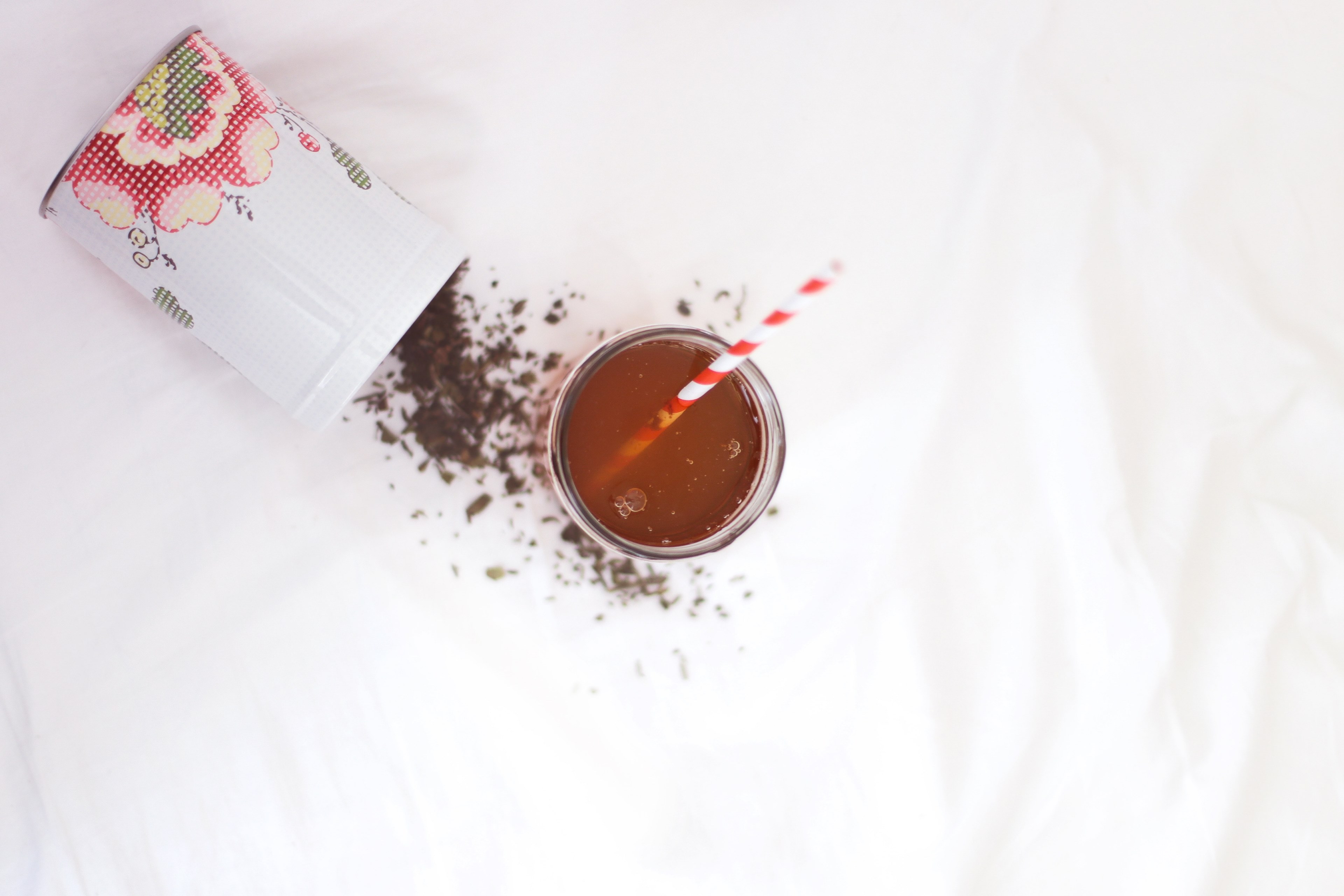 flat lay of a tea drink and a spilled container of loose tea leaves, summertime tea 4k, HD Wallpaper