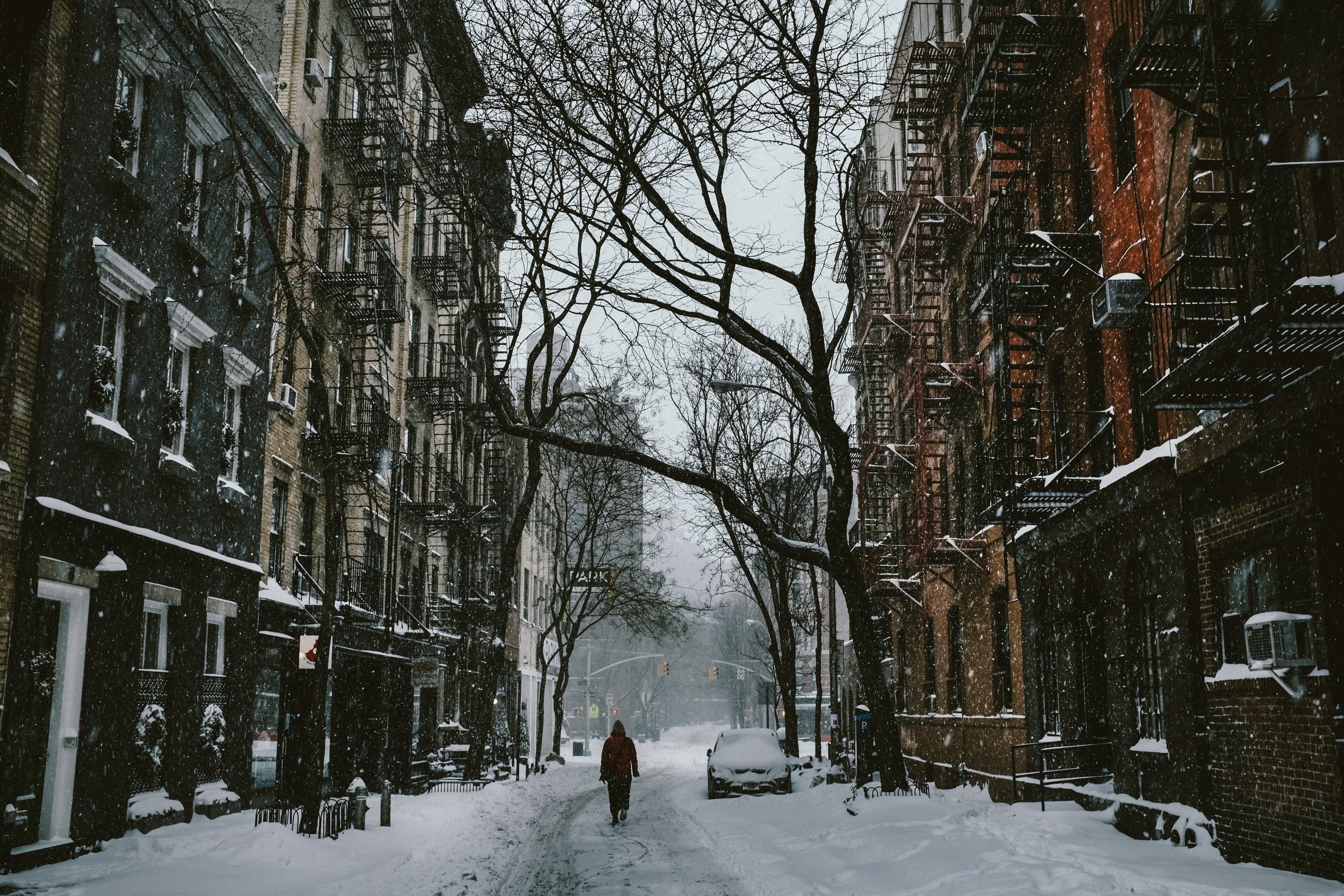a person walking down the snow covered street surrounded by houses and trees in the city, _person walks west village street 4k, HD Wallpaper