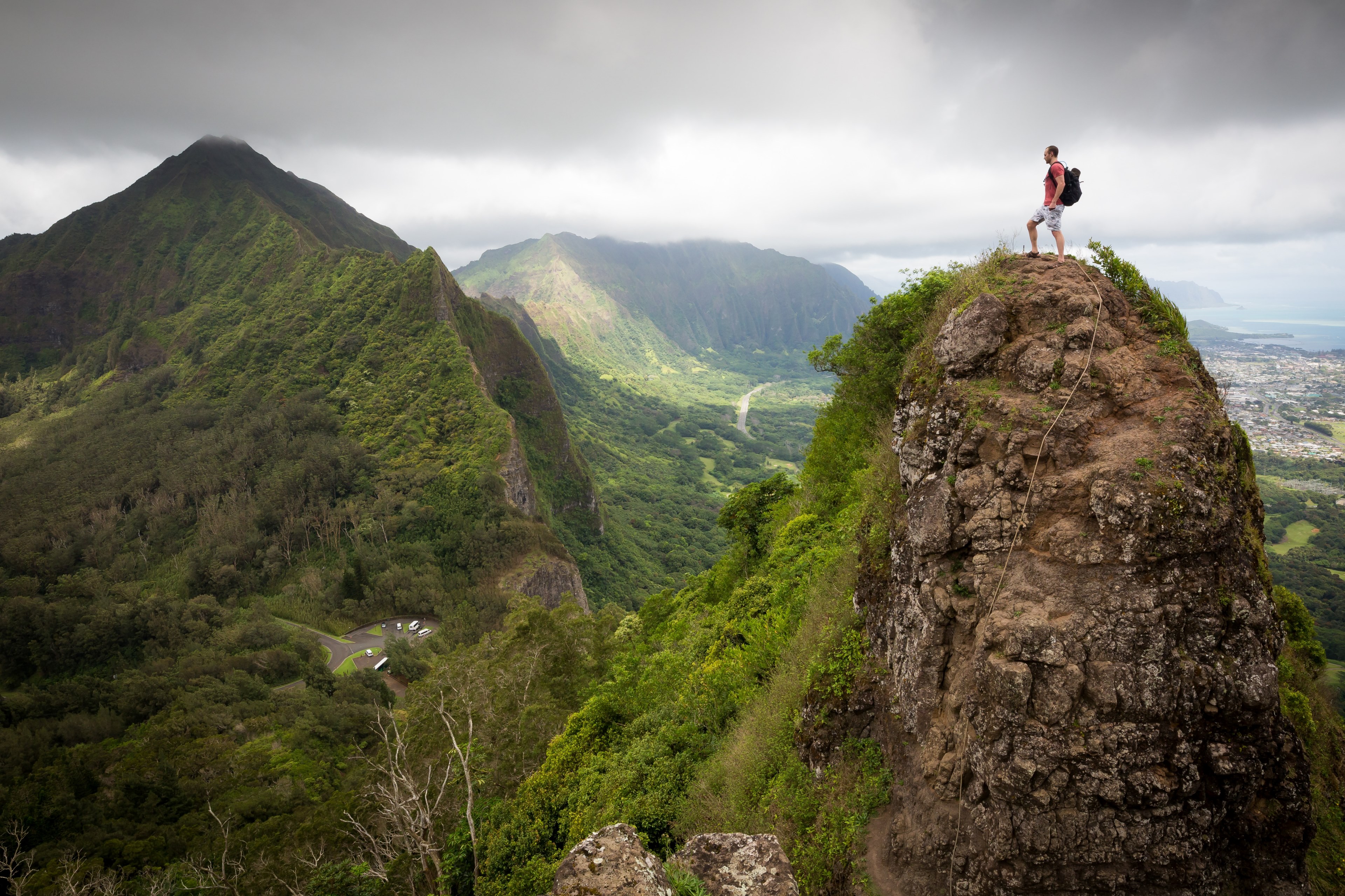 a mountaineer on top of a round rocky peak, scaling a mountain peak 4k, HD Wallpaper