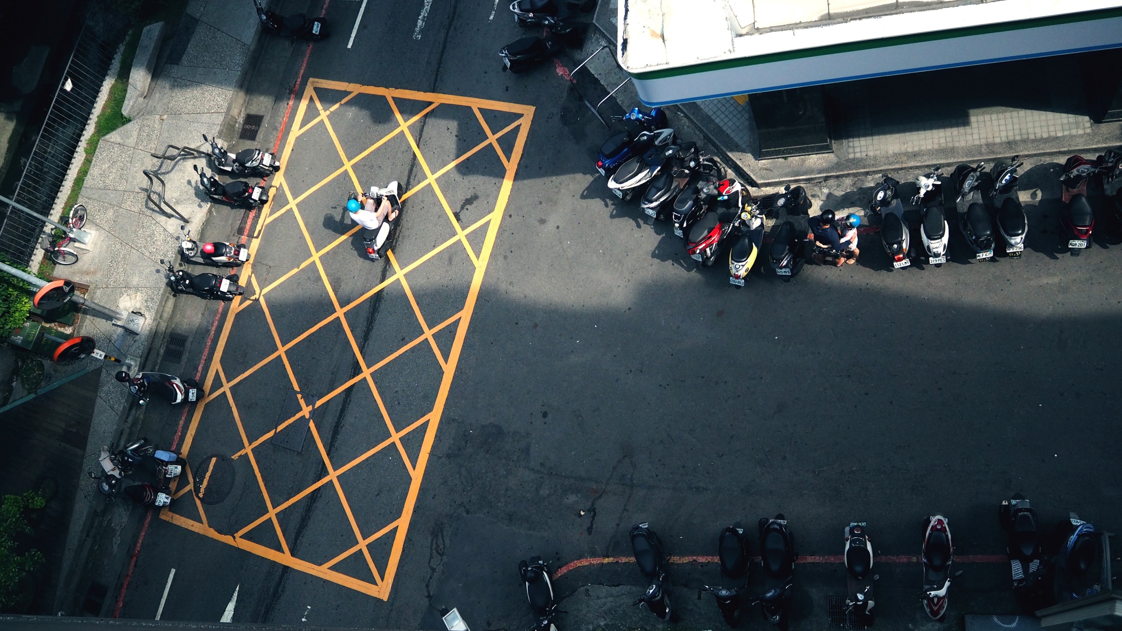 drone view of street with buildings sidewalks and rows of mopeds and scooters in urban area, drone moped scooter rows 4k, HD Wallpaper