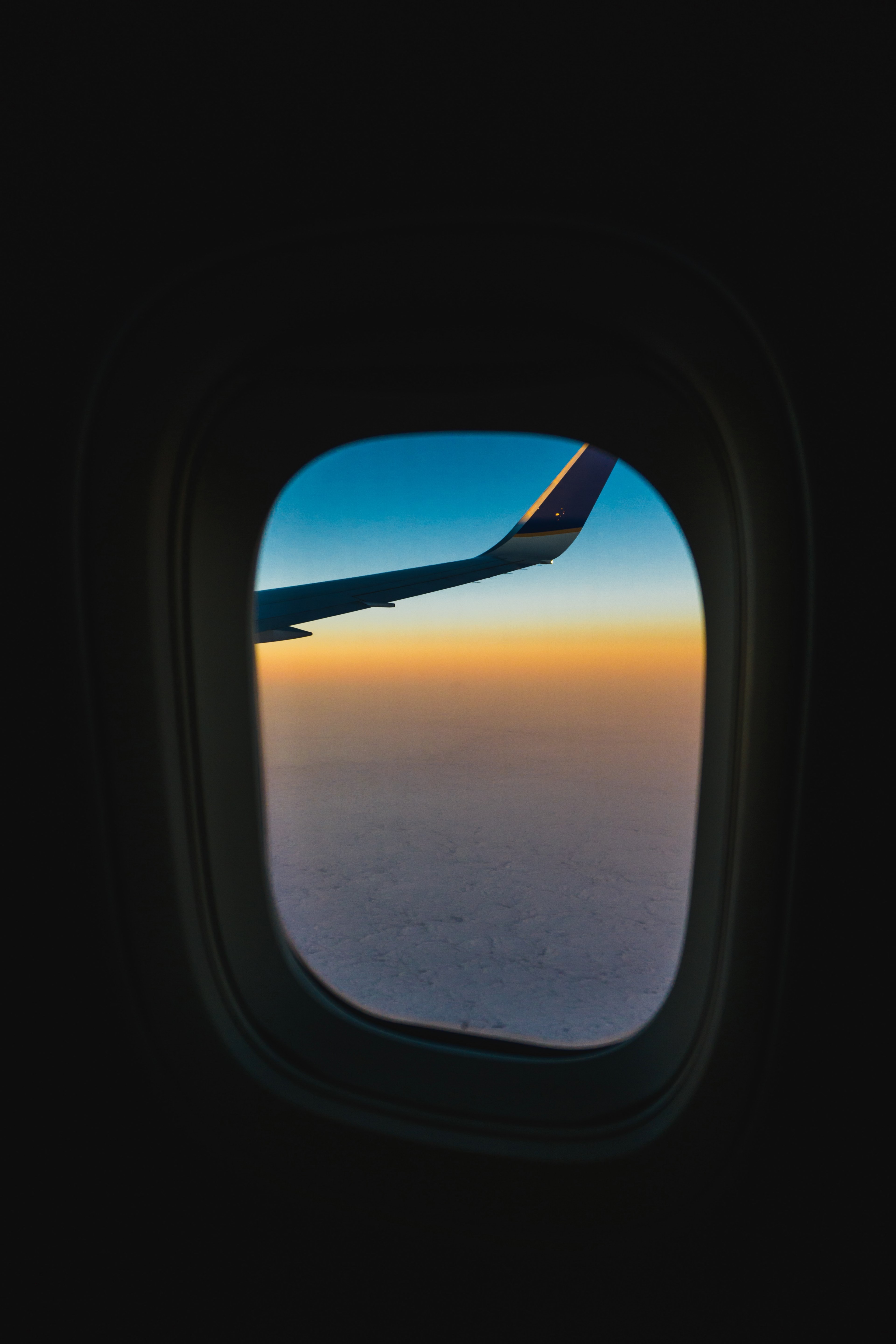 looking out an airplane window at the planes wing and a blue skyline, plane and simple vol_2 4k, Phone HD Wallpaper