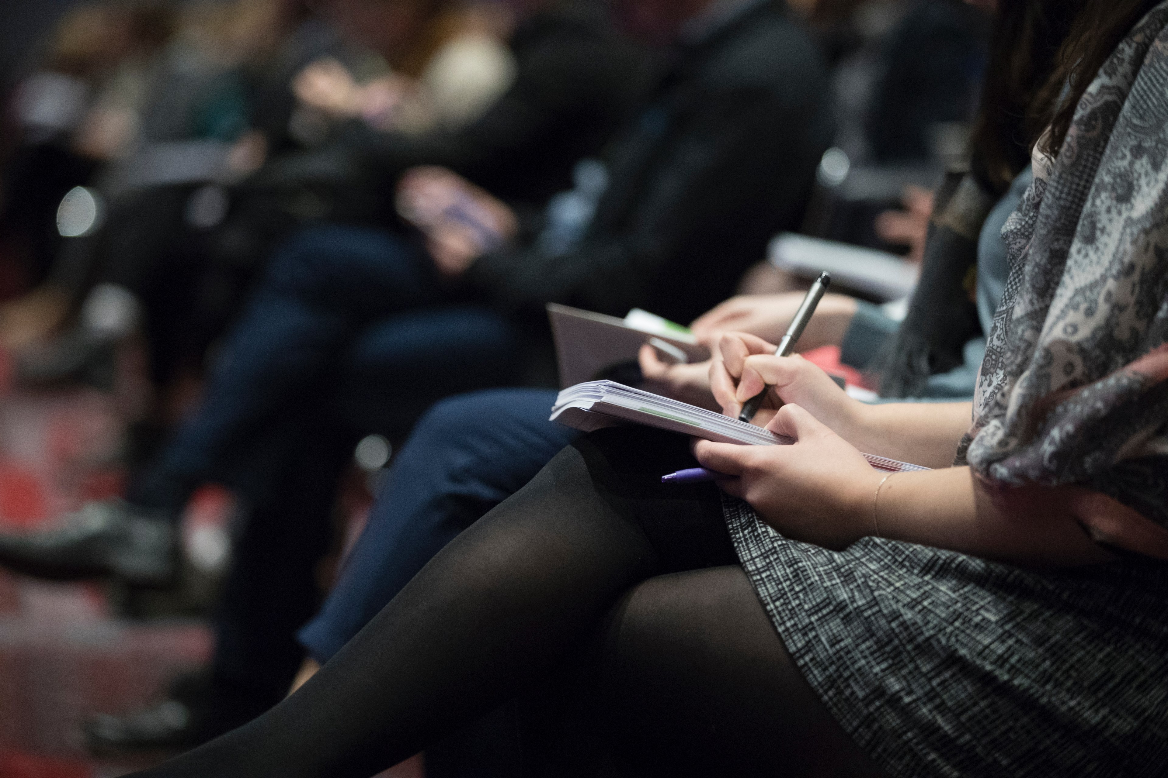 a close up of a woman taking notes using pen and notebook in an event, _woman pen notebook 4k, HD Wallpaper