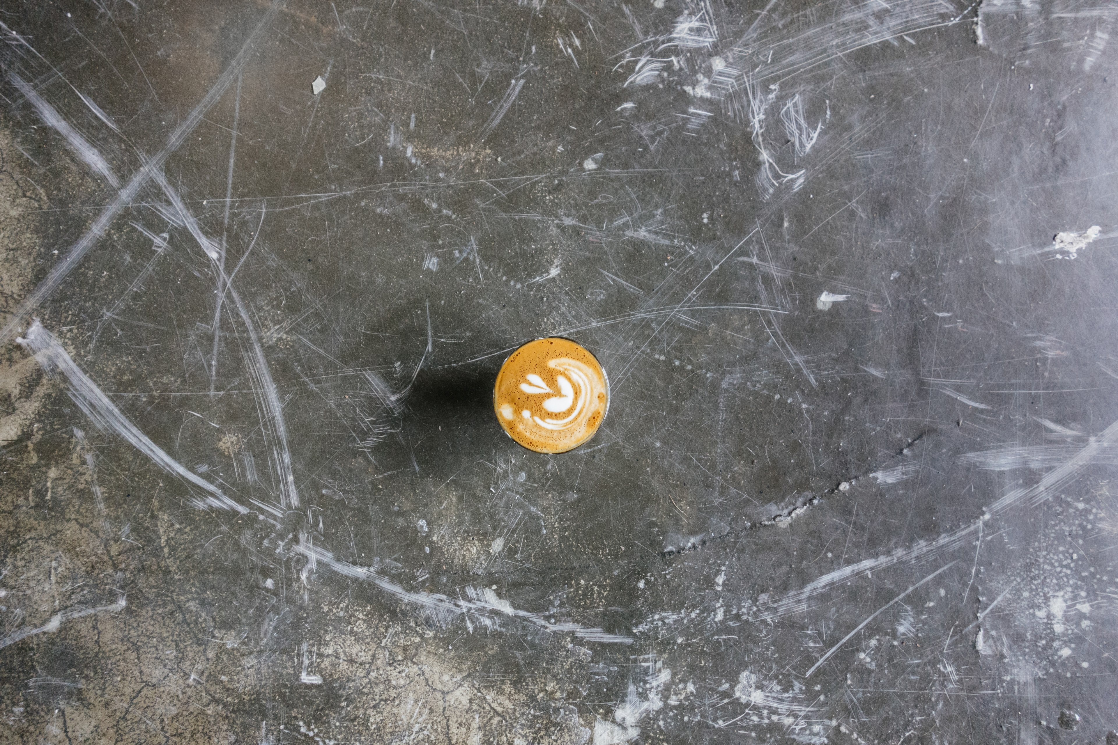 cappuccino with heart foam art on a scratched but smooth concrete table, coffee on a concrete surface 4k, HD Wallpaper