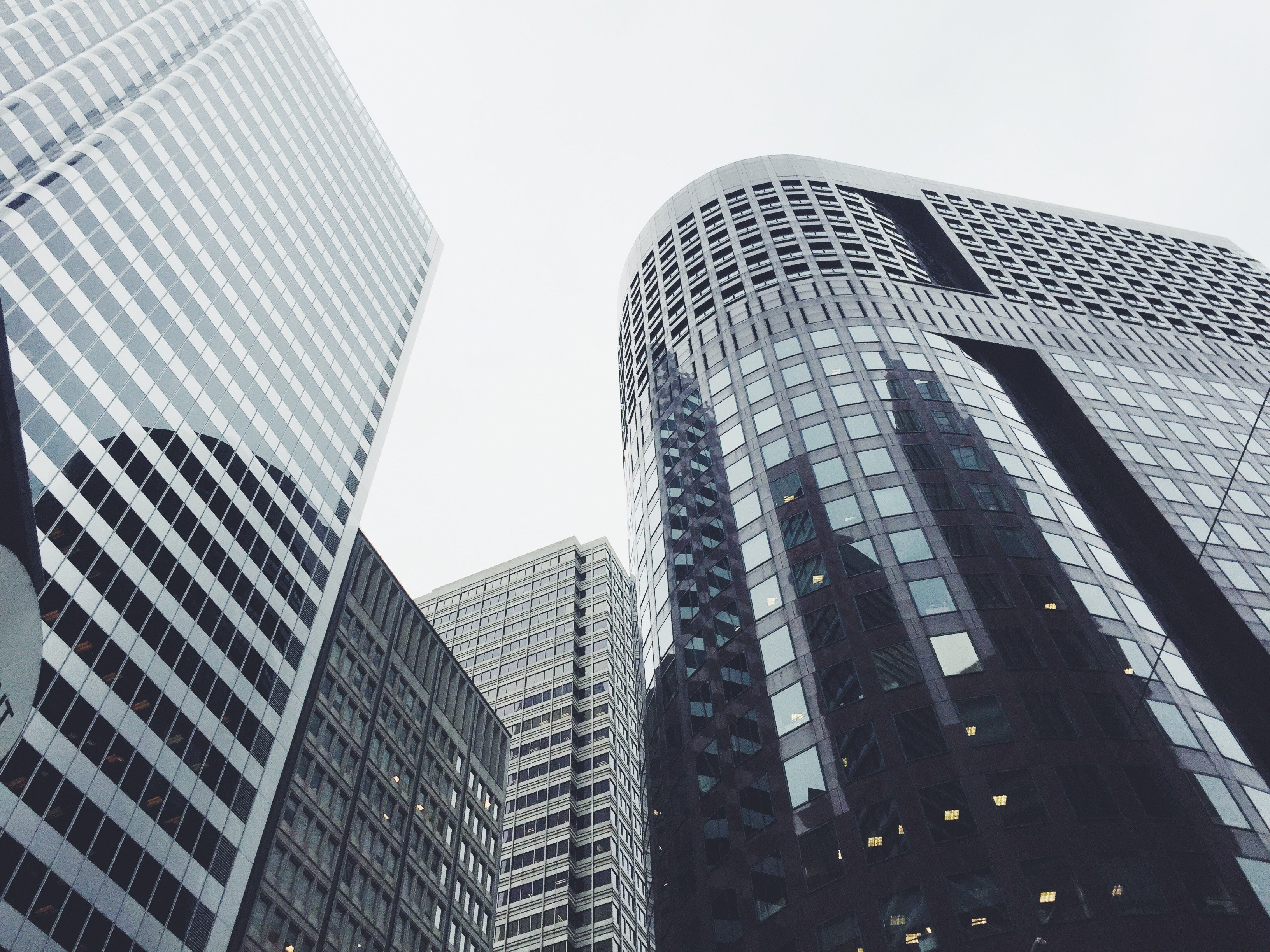 high rise facades in various shades of gray under a white sky, skyscrapers in the city 4k, HD Wallpaper