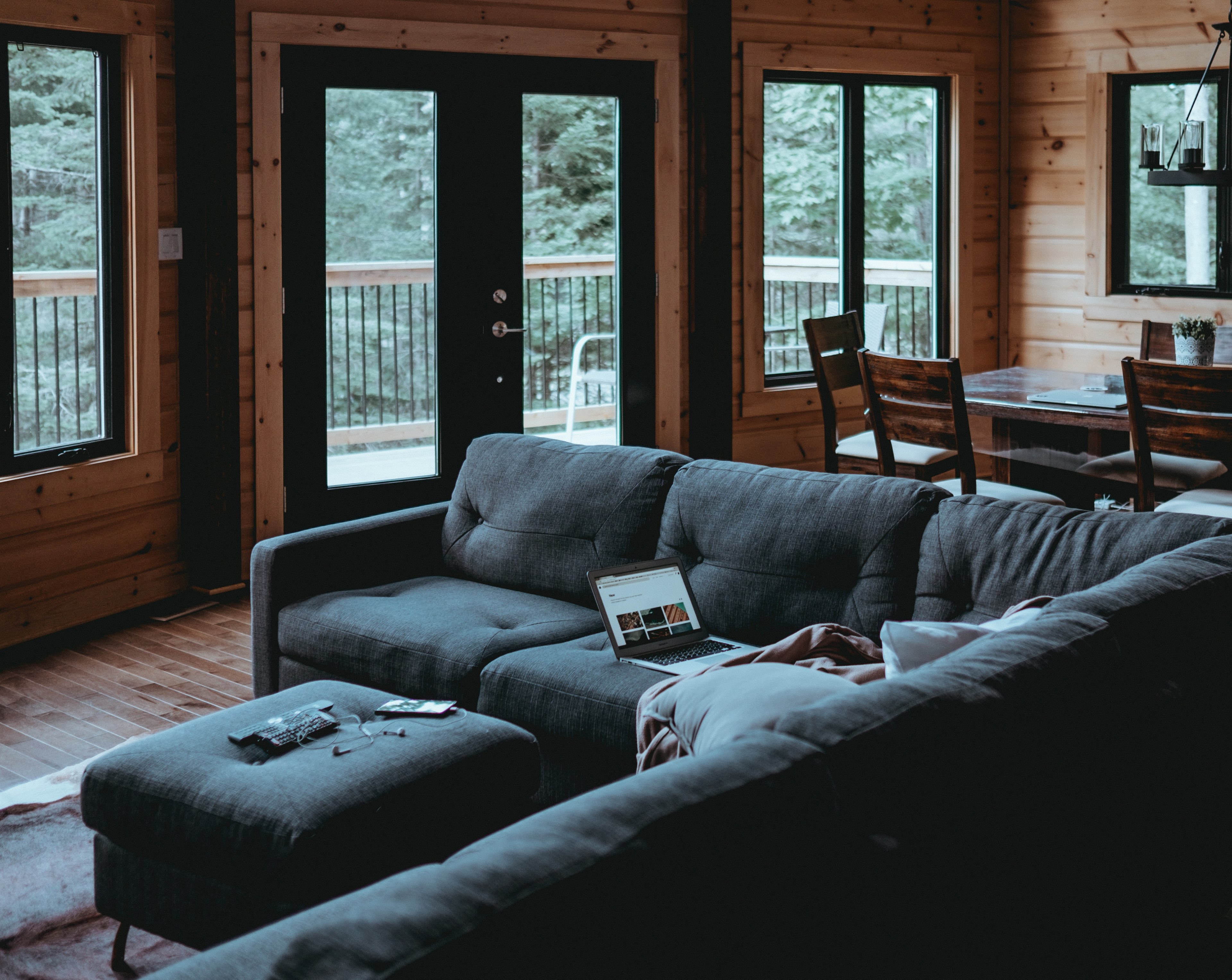 black leather couch in a well kept wooden cabin in the forest, working from home 4k, HD Wallpaper