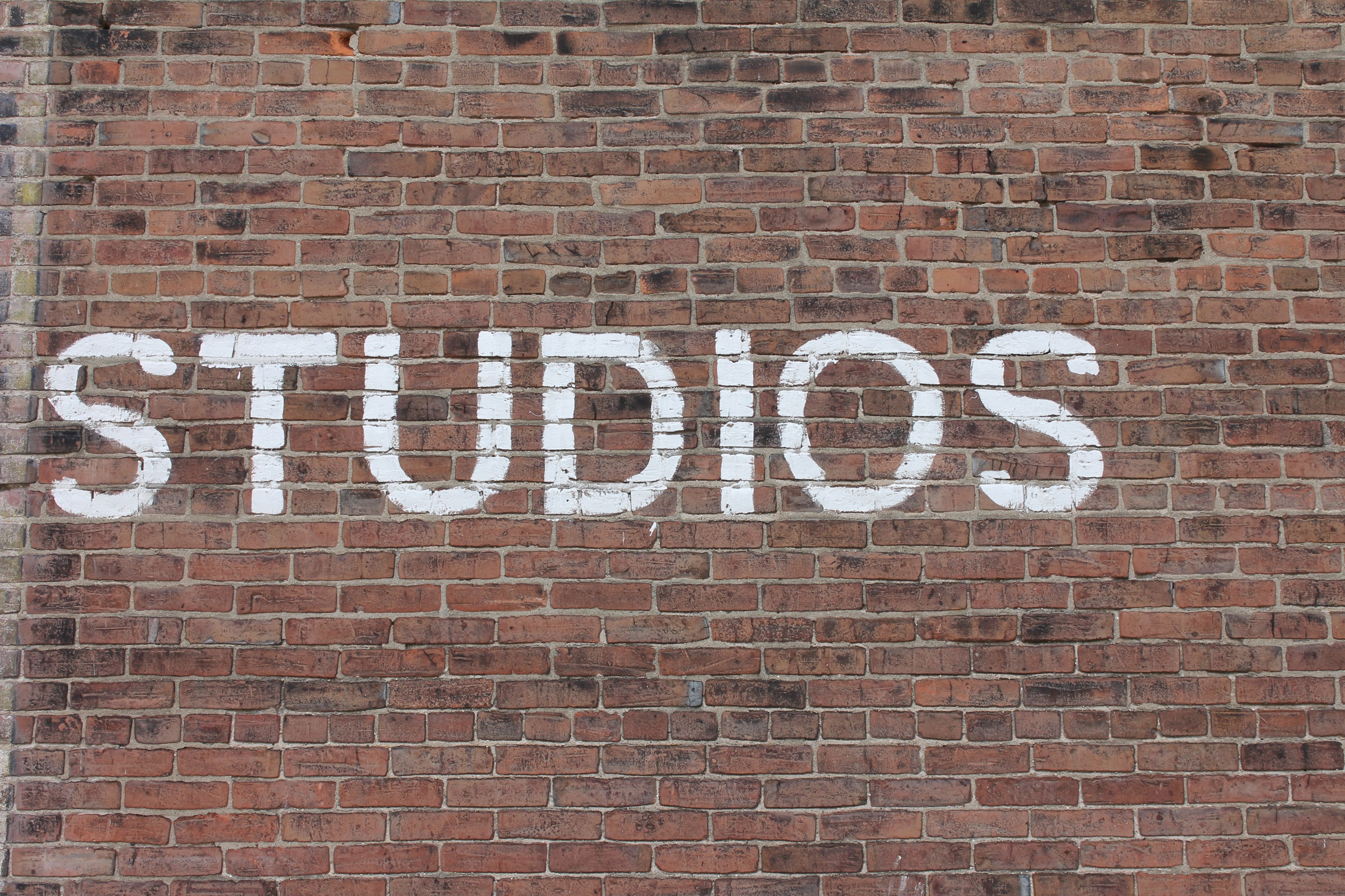 brick wall with lettering that says studio 4k, HD Wallpaper