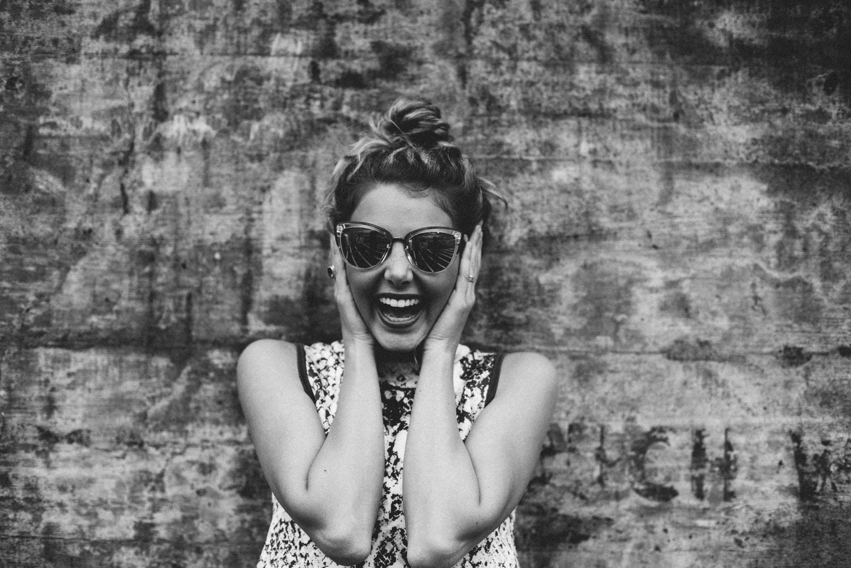 a woman with a large smile wearing sunglasses with her hands up on either side of her head, woman smiling in sunglasses 4k, HD Wallpaper