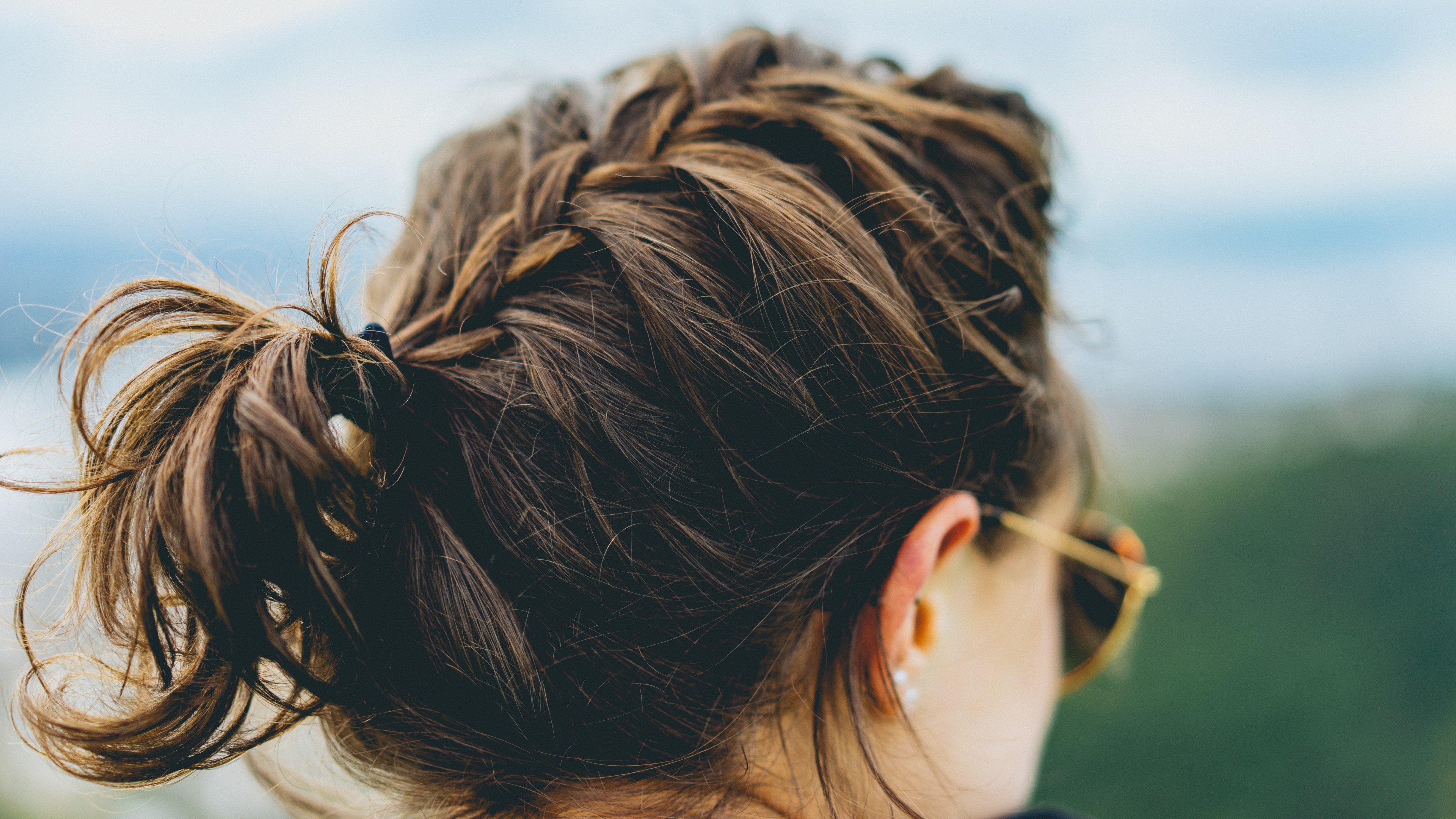 a woman with a braid in sunglasses faces away from the camera against a blue sky, woman with braid 4k, HD Wallpaper