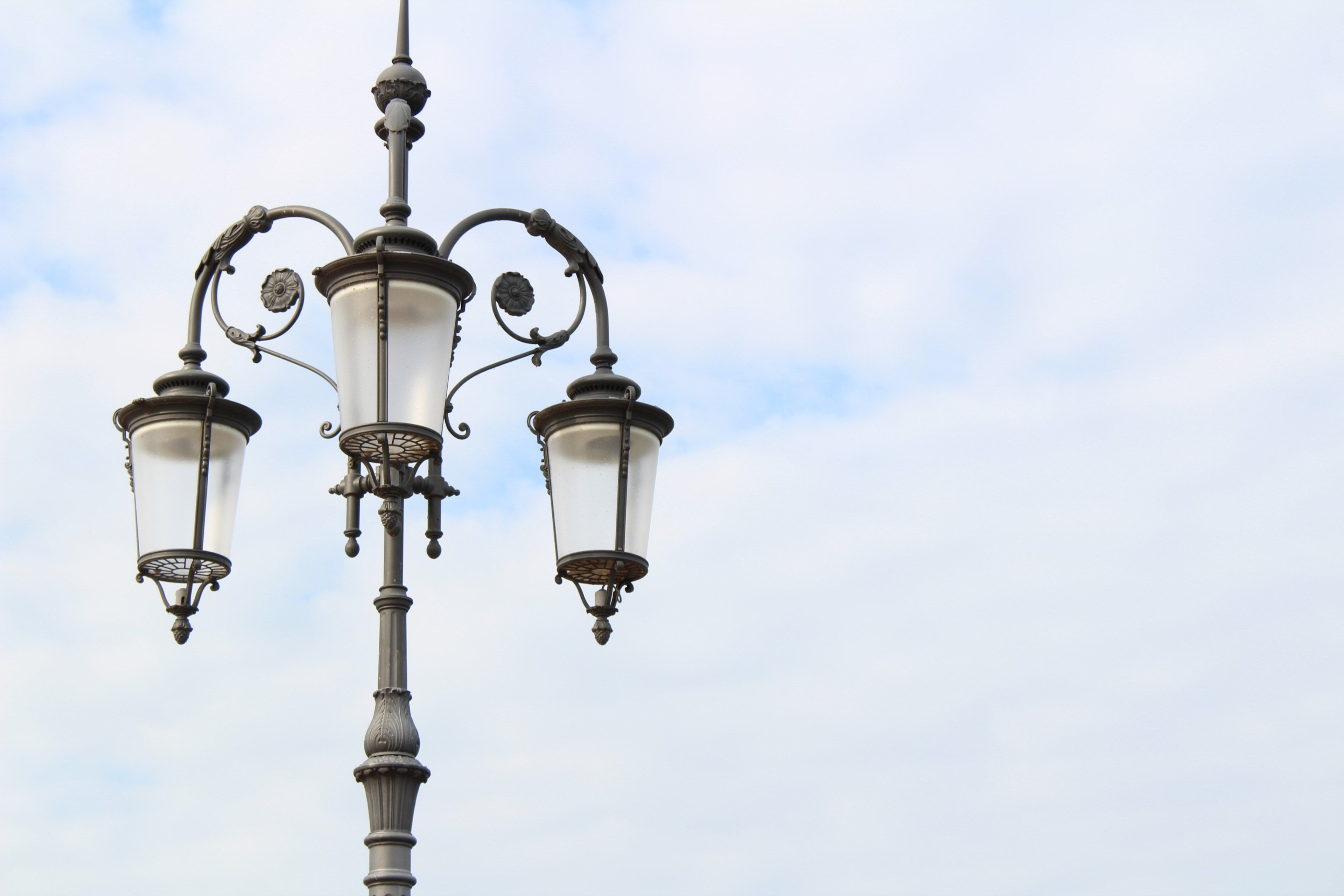 black lamppost with ornate flower designs and three lanterns against a cloudy sky, lantern 4k, HD Wallpaper