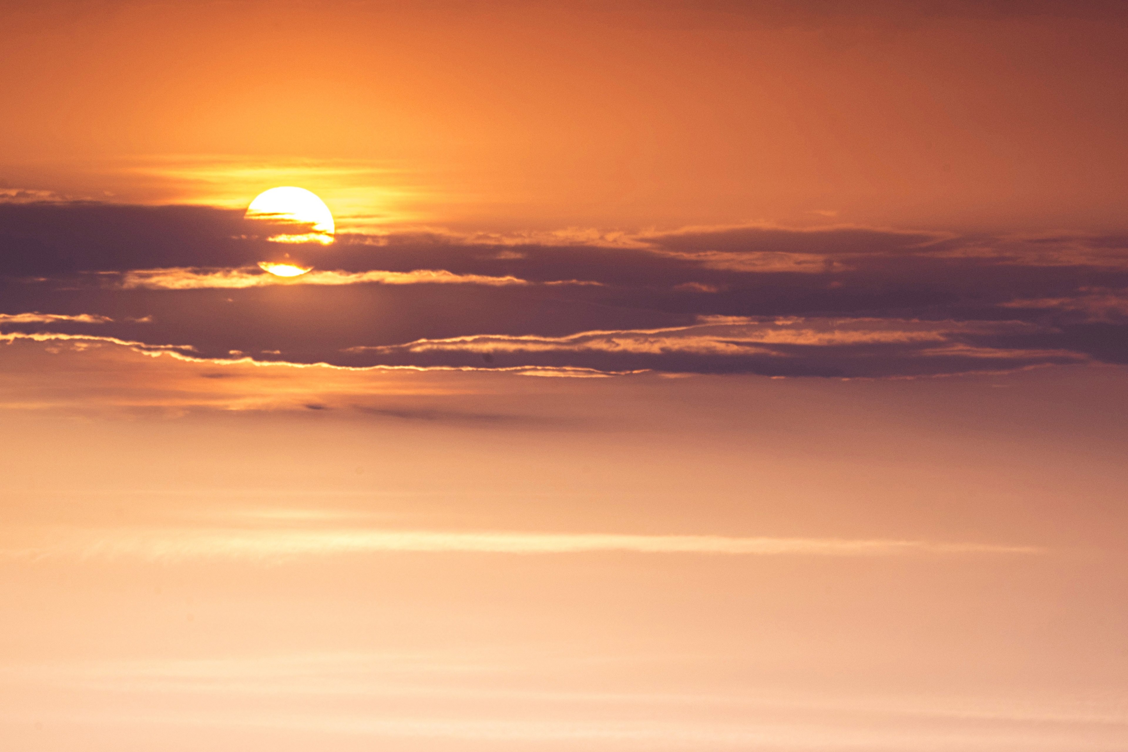 the during sunset behind a cloud against an orange sky in cherepovets, cherepovets sunset 4k, HD Wallpaper